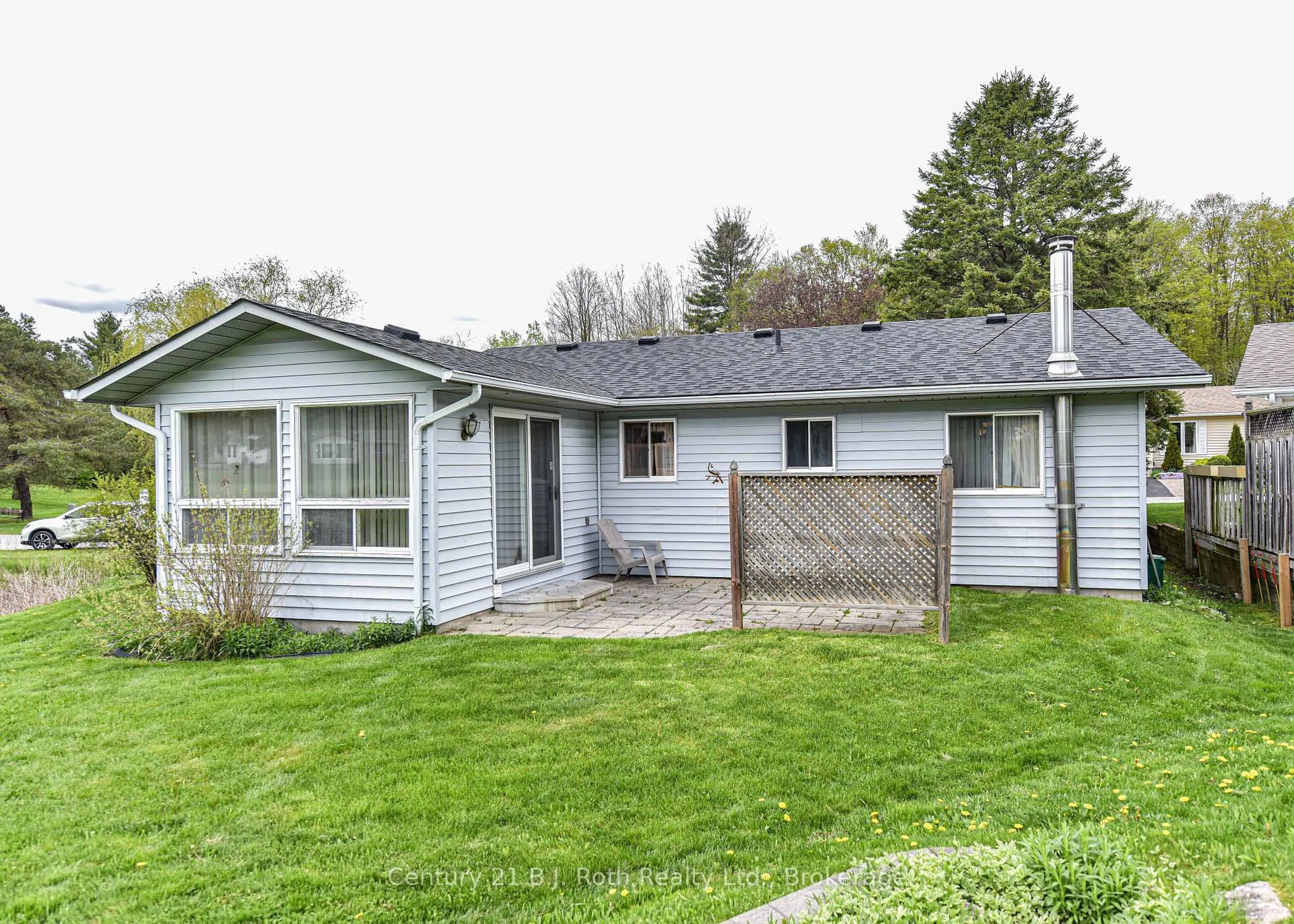 Home with vinyl exterior material, street for 56 TECUMSETH PINES Dr, New Tecumseth Ontario L0G 1W0