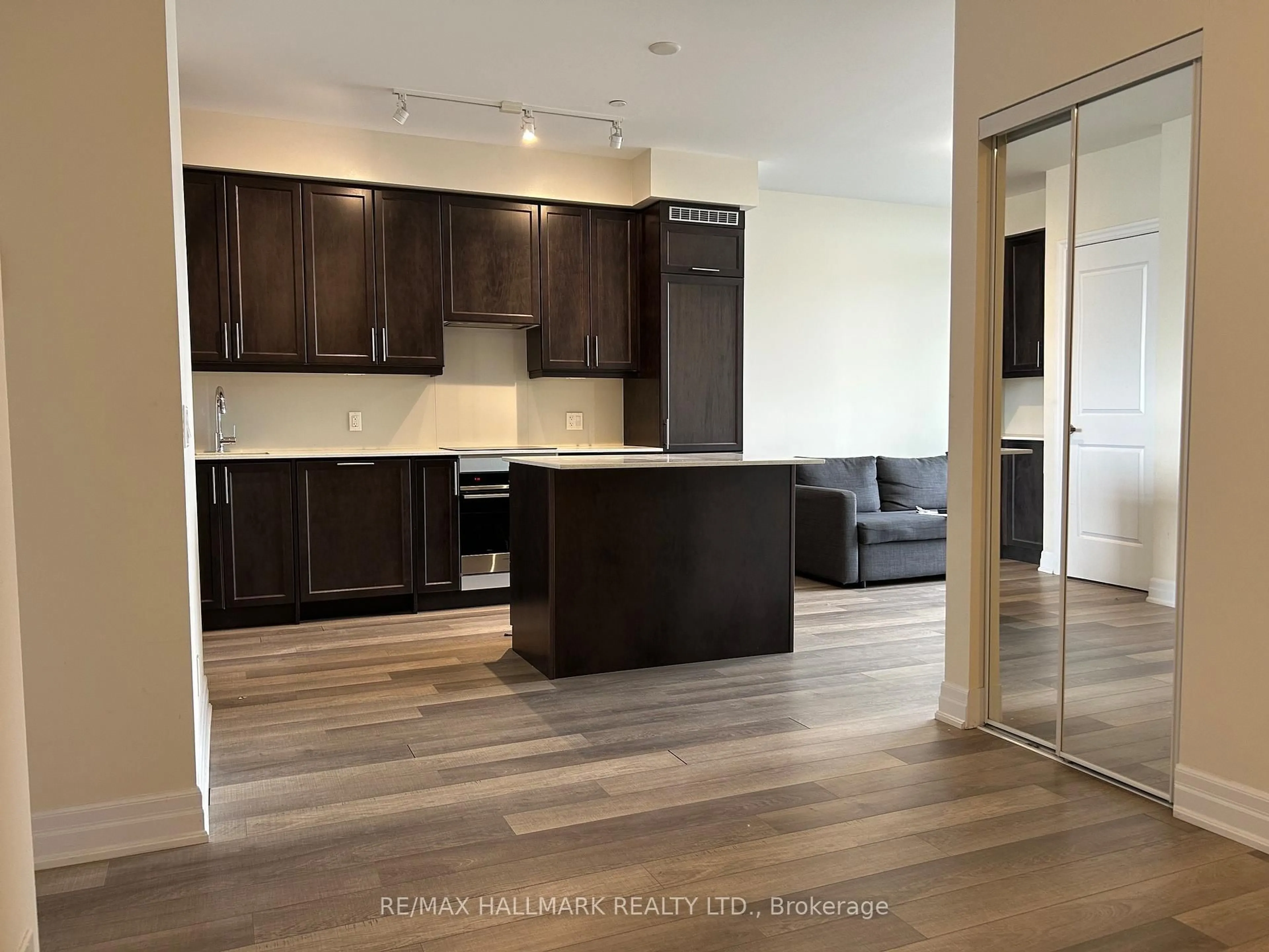 Open concept kitchen, wood/laminate floor for 9085 Jane St #219, Vaughan Ontario L4K 0L8