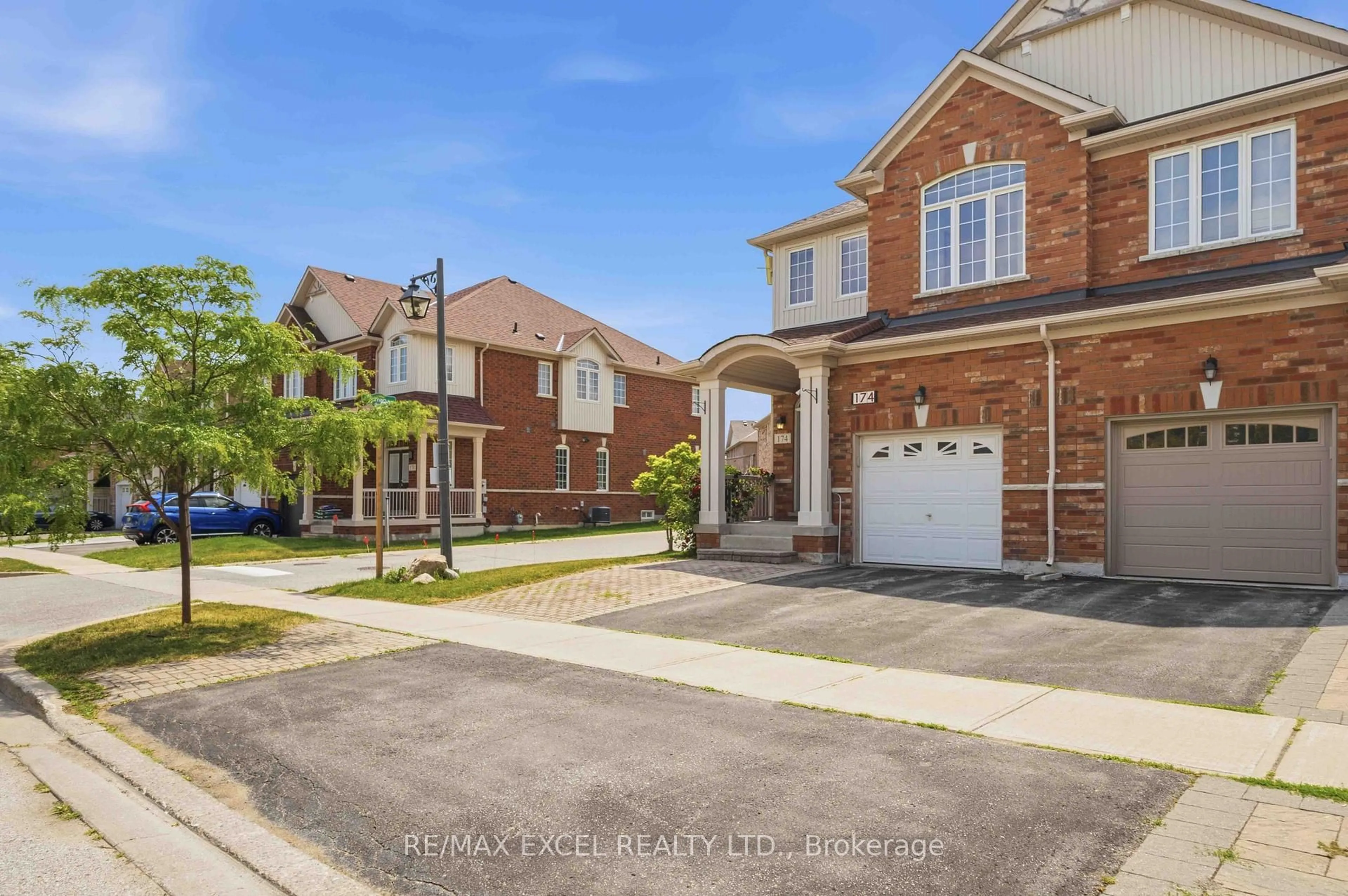 Home with brick exterior material, street for 174 Roy Rainey Ave, Markham Ontario L6E 1G6