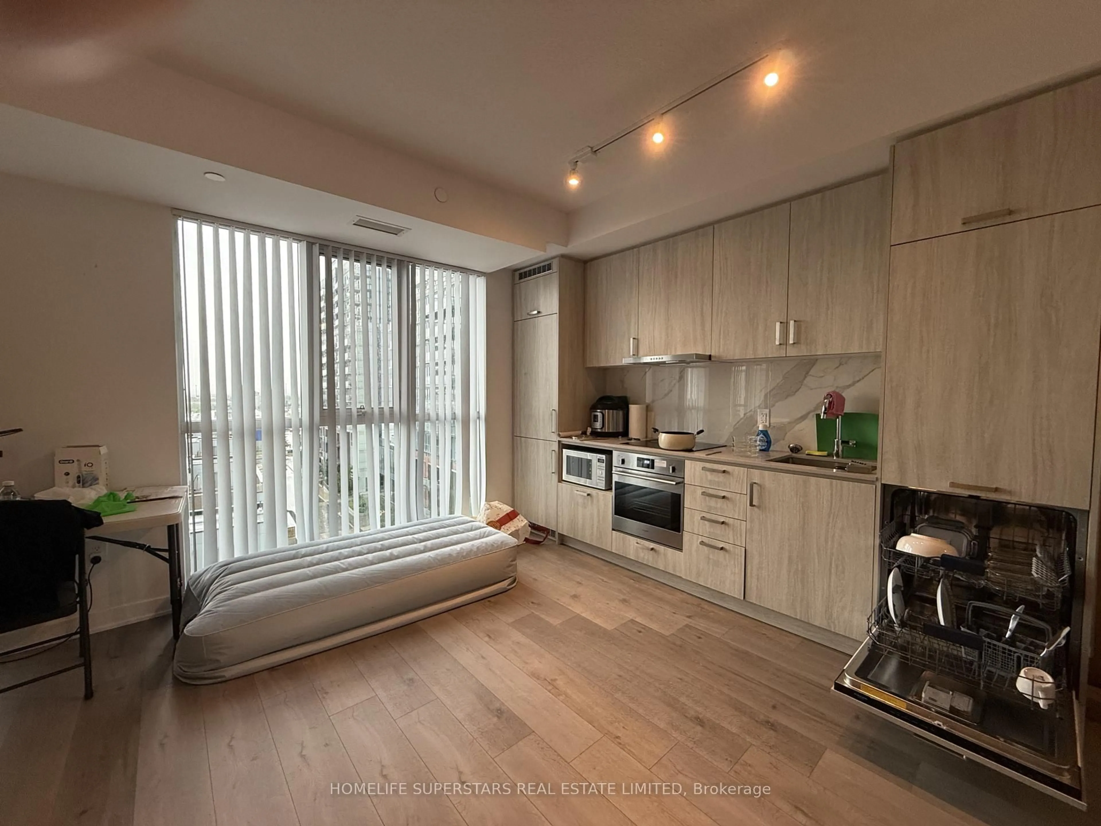 Open concept kitchen, wood/laminate floor for 60 Honeycrisp Cres #706, Vaughan Ontario L4K 0N5