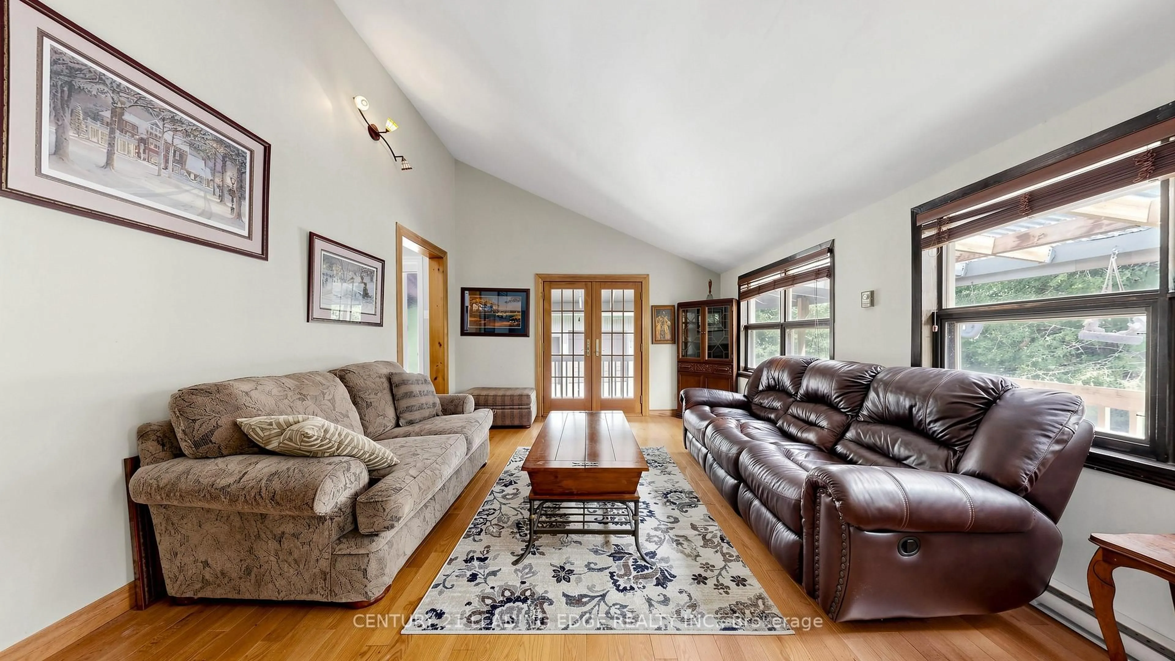 Living room with furniture, wood/laminate floor for 6466 Old Homestead Rd, Georgina Ontario L0E 1R0
