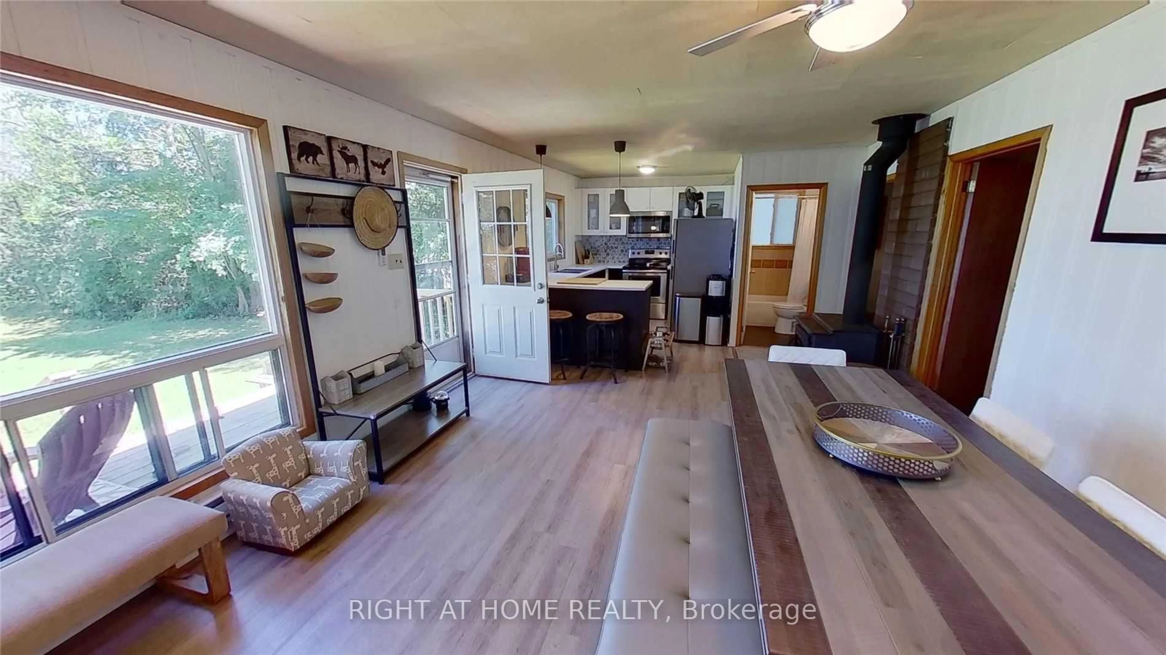 Open concept kitchen, wood/laminate floor for 1529 Chief Joseph Snake Rd, Georgina Islands Ontario L0E 1R0
