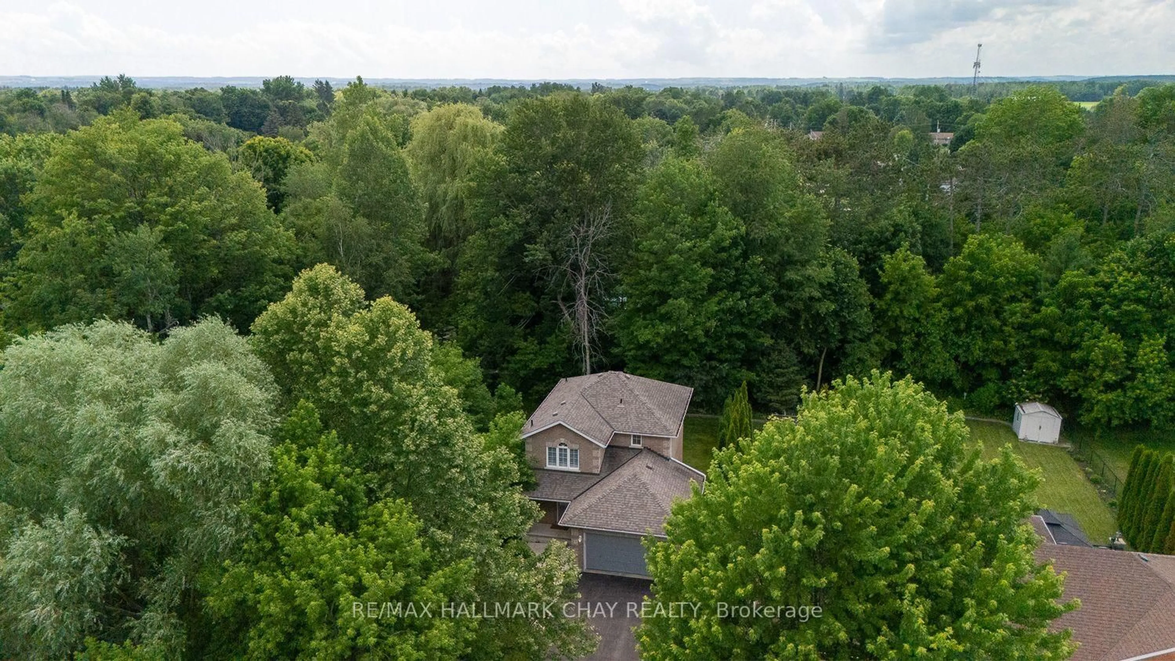 A pic from outside/outdoor area/front of a property/back of a property/a pic from drone, forest/trees view for 23 Burbank Circ, Adjala-Tosorontio Ontario L0M 1J0