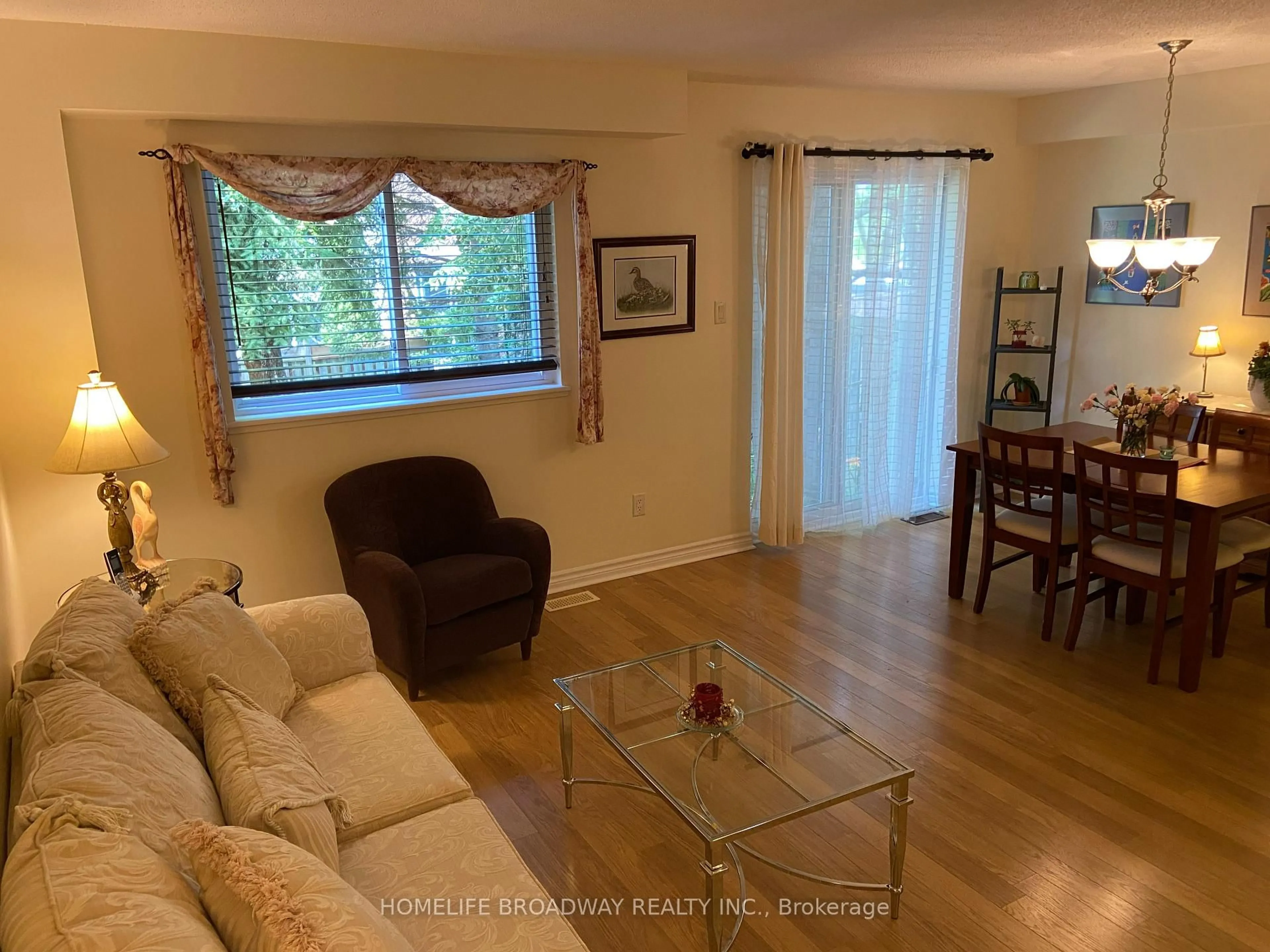 Living room with furniture, wood/laminate floor for 517 Jack Giles Circ #26, Newmarket Ontario L3X 1X8