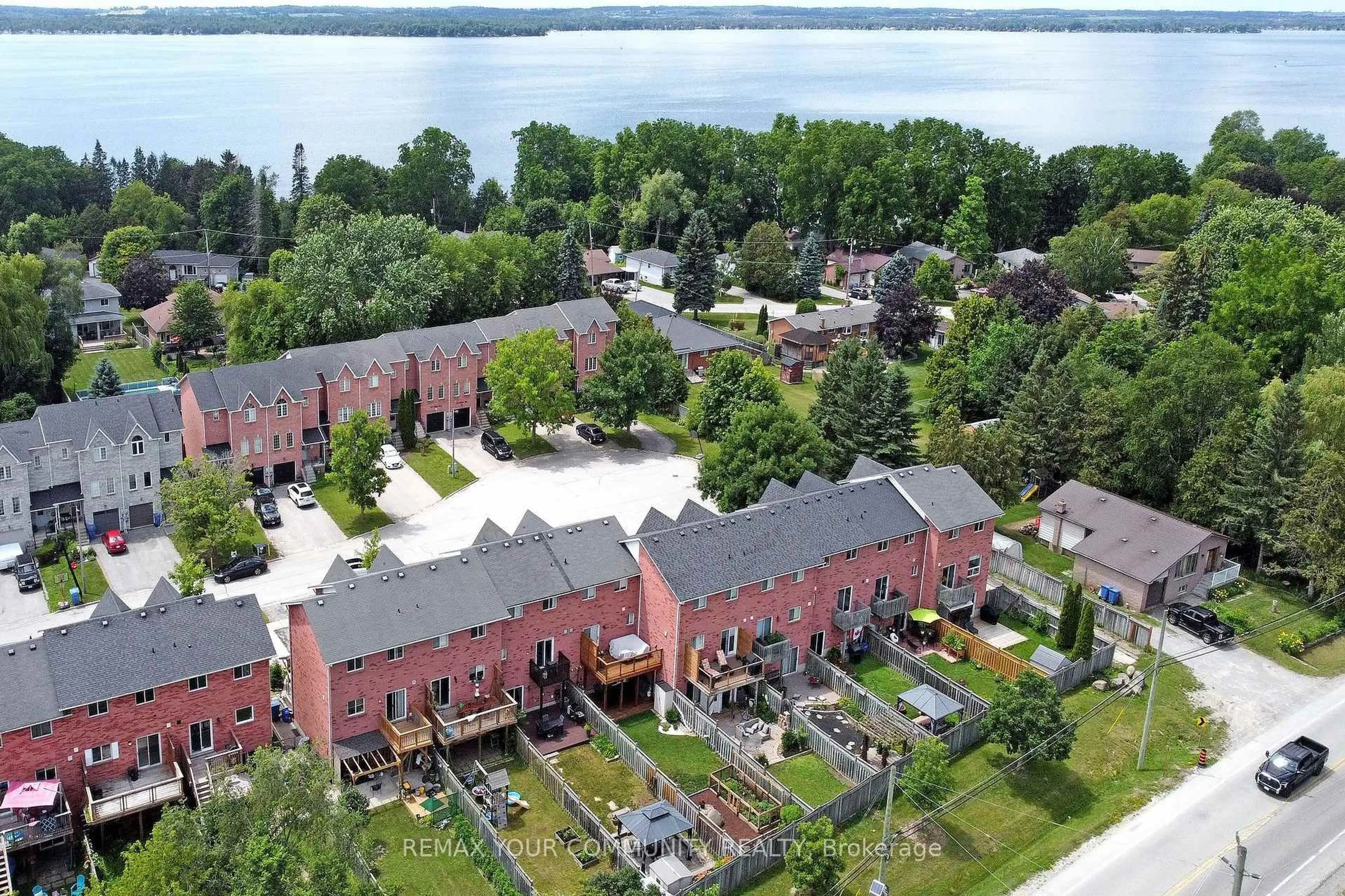 A pic from outside/outdoor area/front of a property/back of a property/a pic from drone, water/lake/river/ocean view for 57 Hattie Crt, Georgina Ontario L4P 3Z8