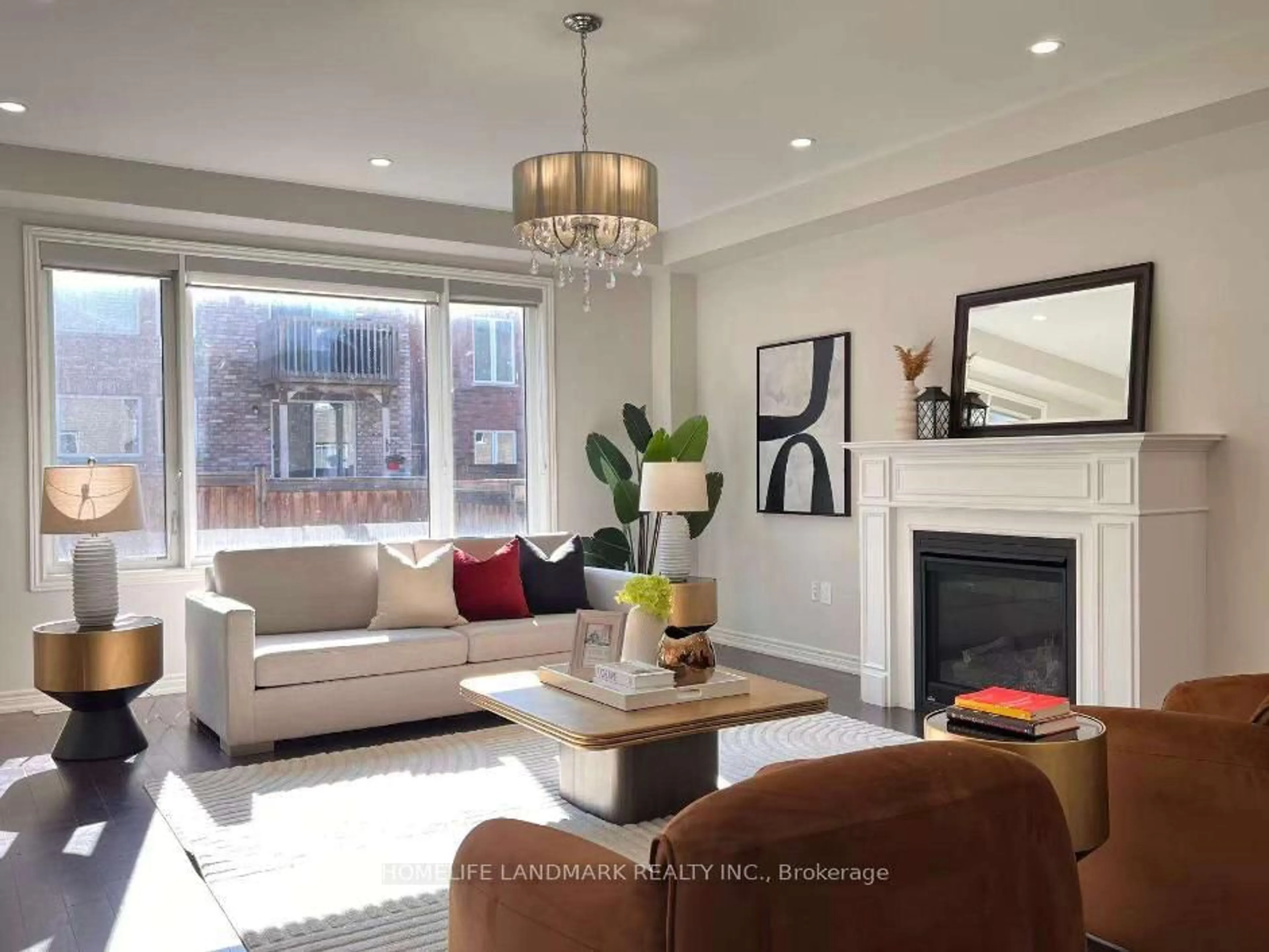Living room with furniture, wood/laminate floor for 79 Forest Edge Cres, East Gwillimbury Ontario L9N 1R8