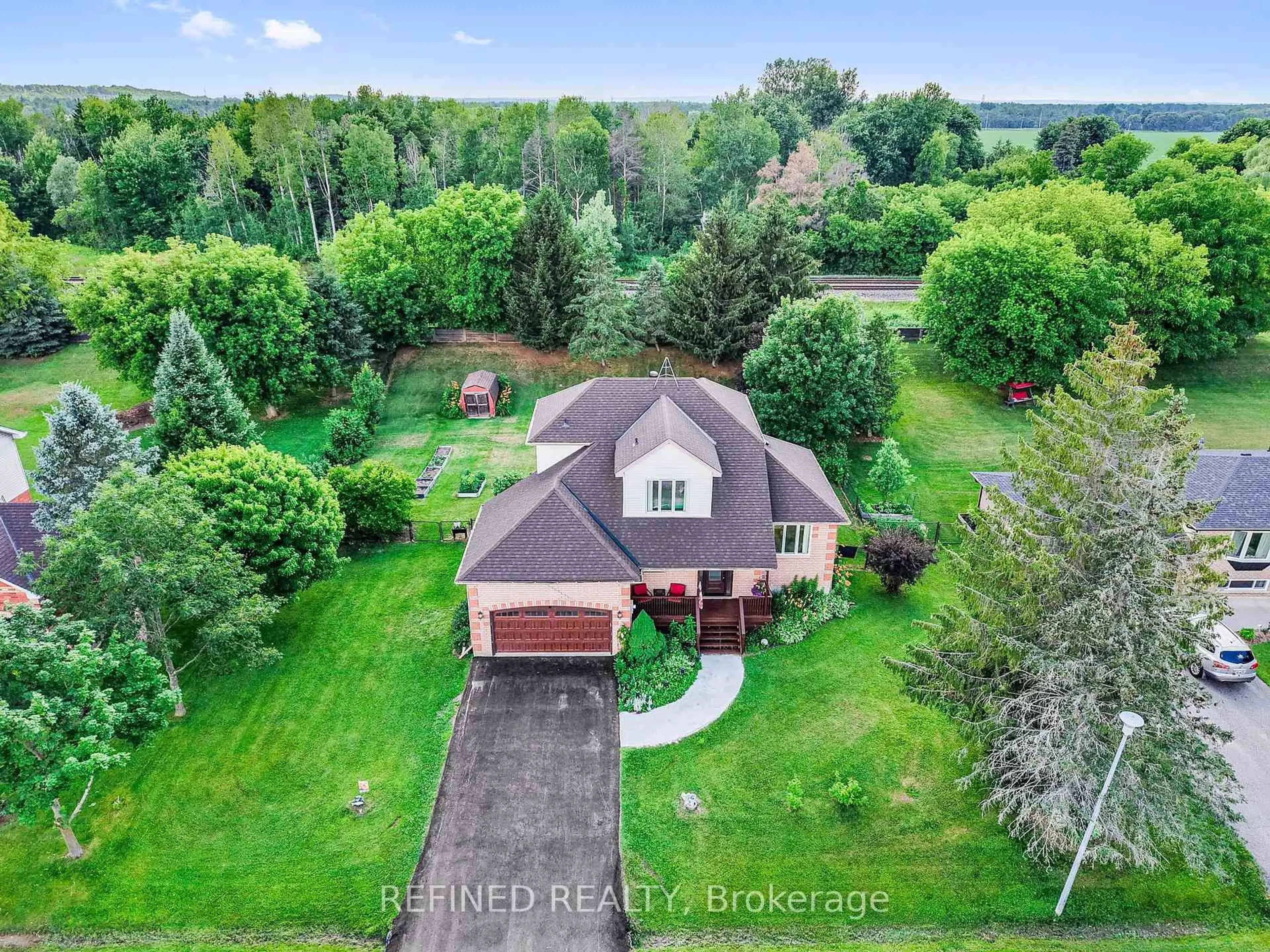 A pic from outside/outdoor area/front of a property/back of a property/a pic from drone, water/lake/river/ocean view for 39 Marshall Cres, Essa Ontario L0M 1B0