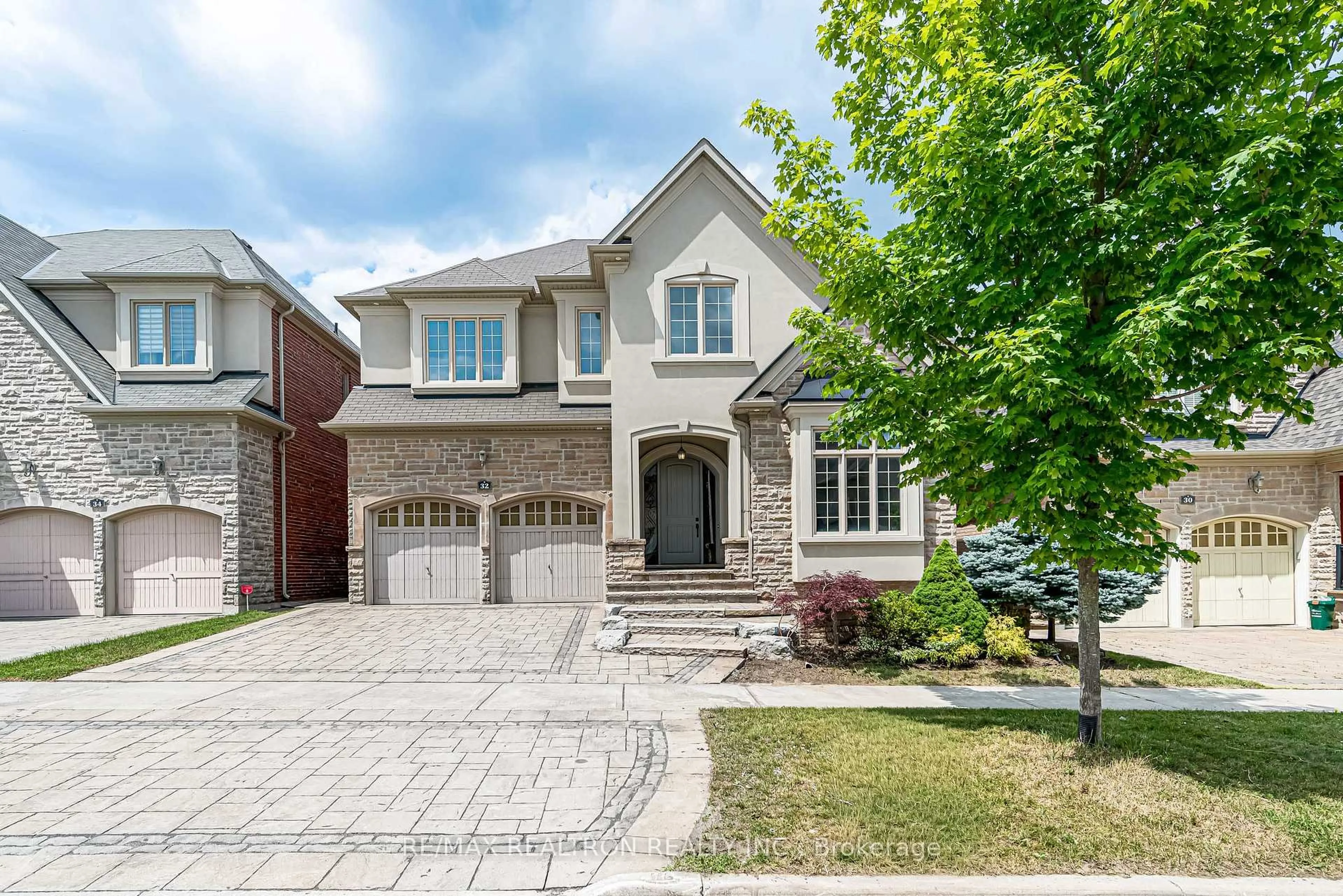 Home with brick exterior material, street for 32 Royal West Rd, Markham Ontario L6C 0L5