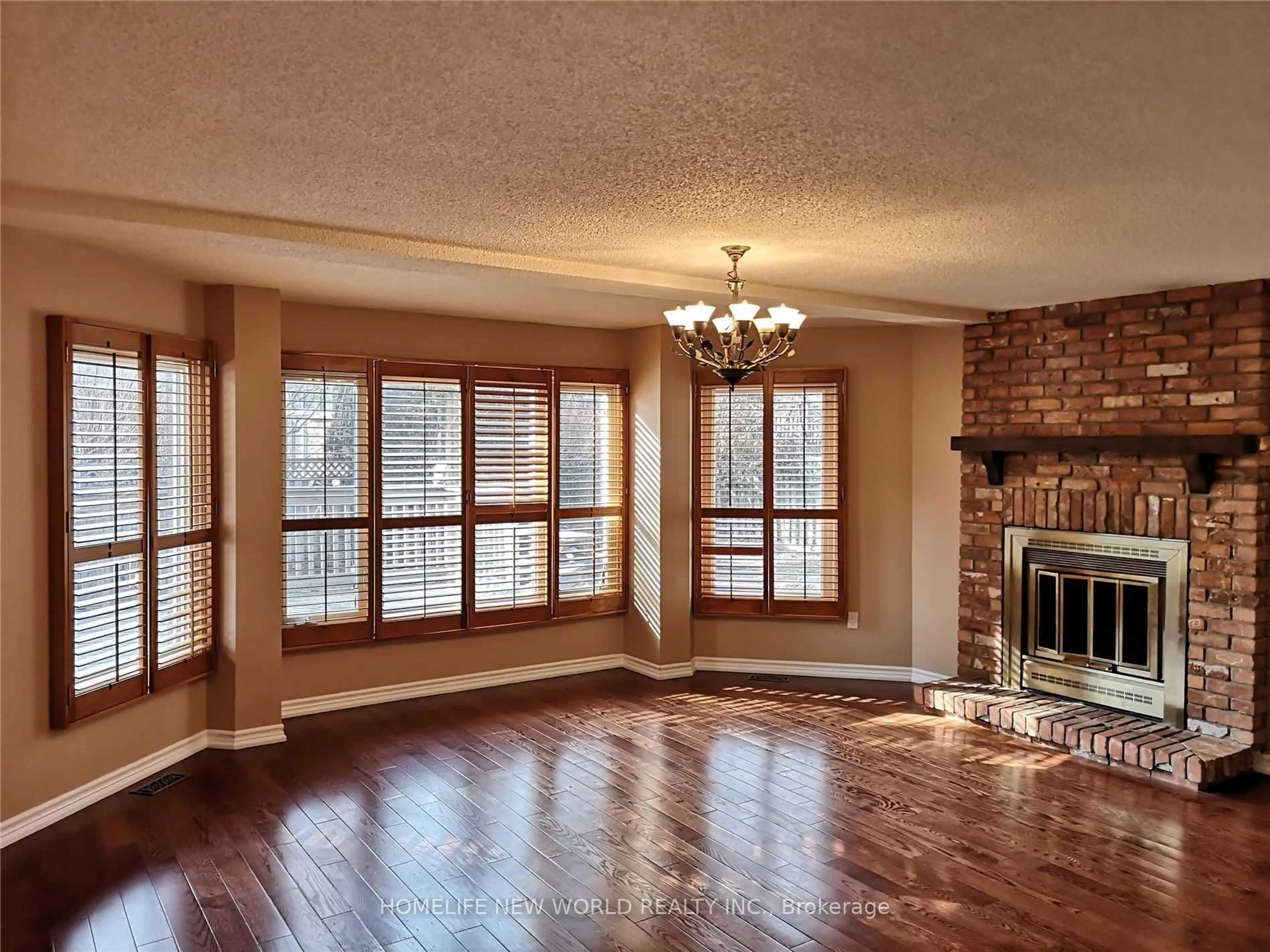 Living room with furniture, wood/laminate floor for 41 Ambleside Cres, Markham Ontario L3R 7T3