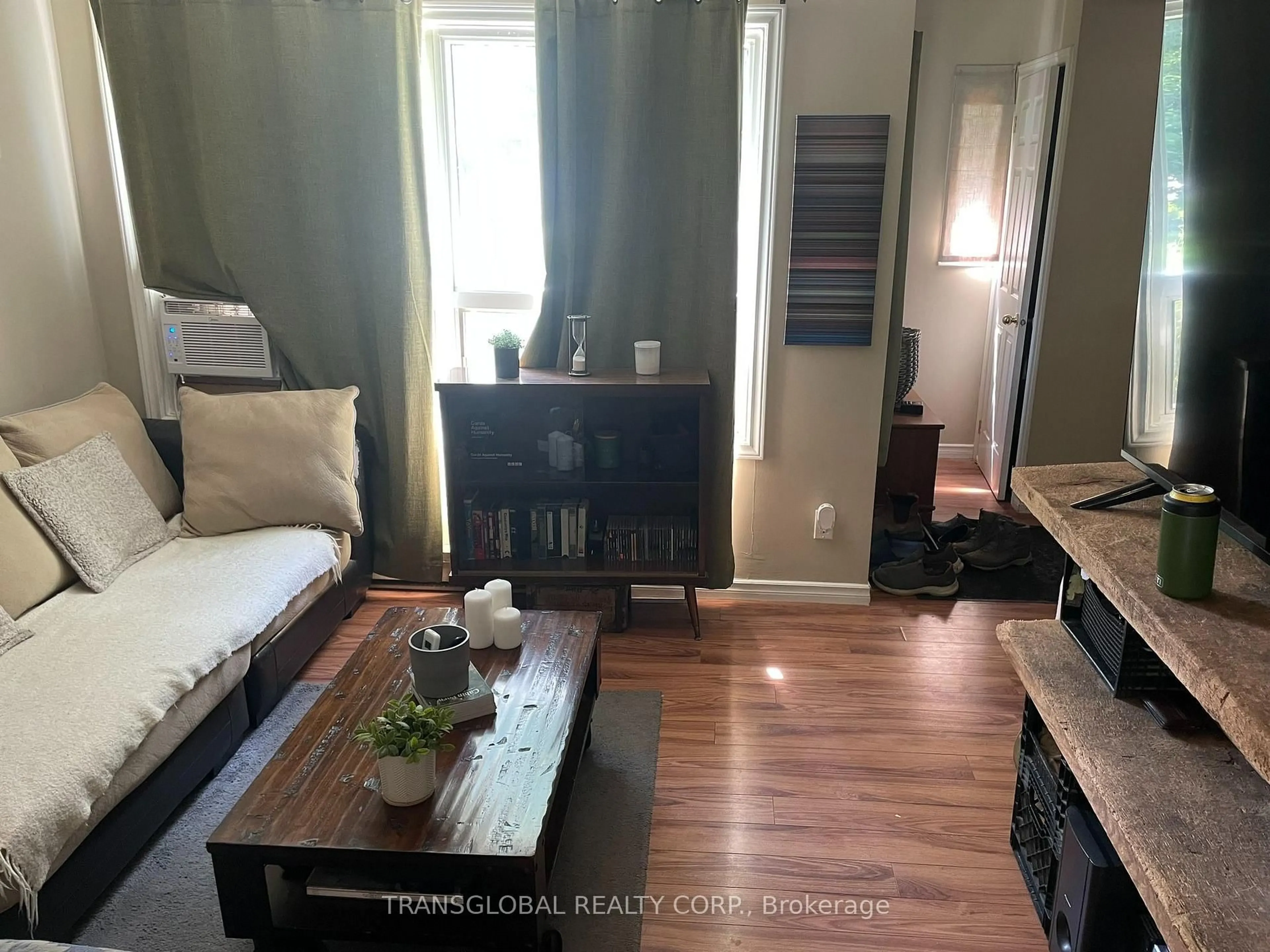 Living room with furniture, wood/laminate floor for 1014 Barton Ave, Georgina Ontario L4P 3E9