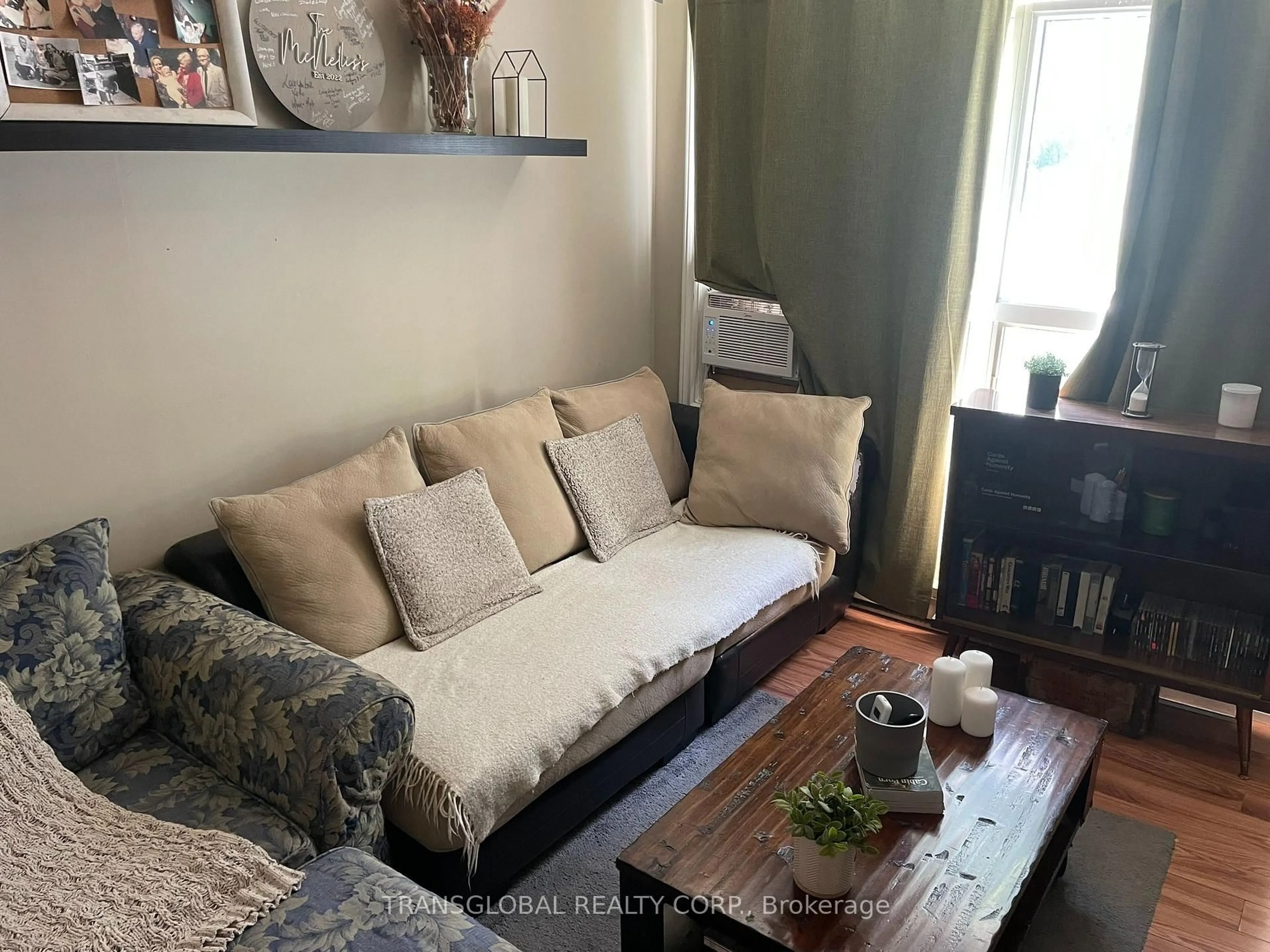 Living room with furniture, wood/laminate floor for 1014 Barton Ave, Georgina Ontario L4P 3E9