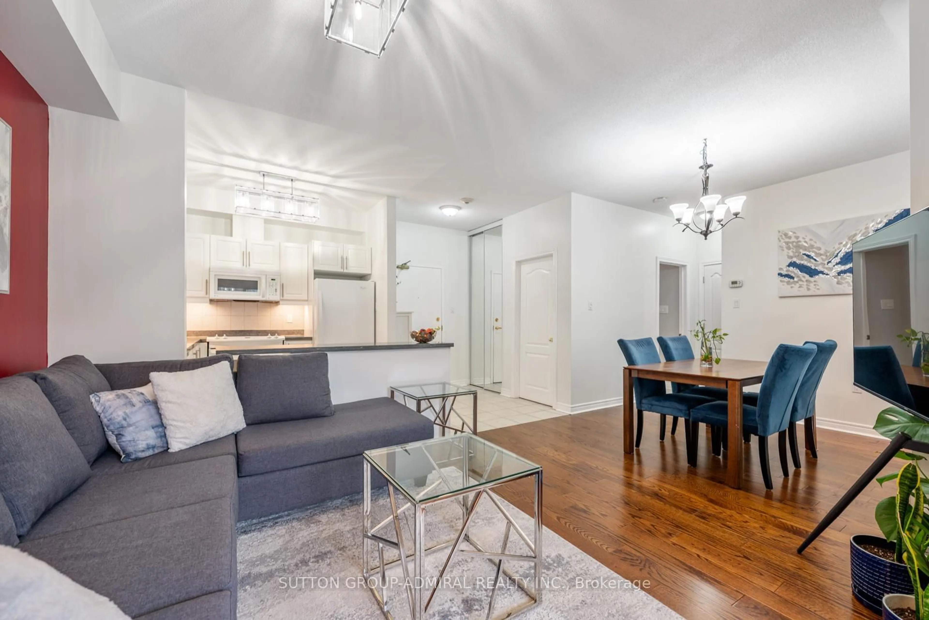 Living room with furniture, wood/laminate floor for 9944 Keele St #102, Vaughan Ontario L6A 3Z4