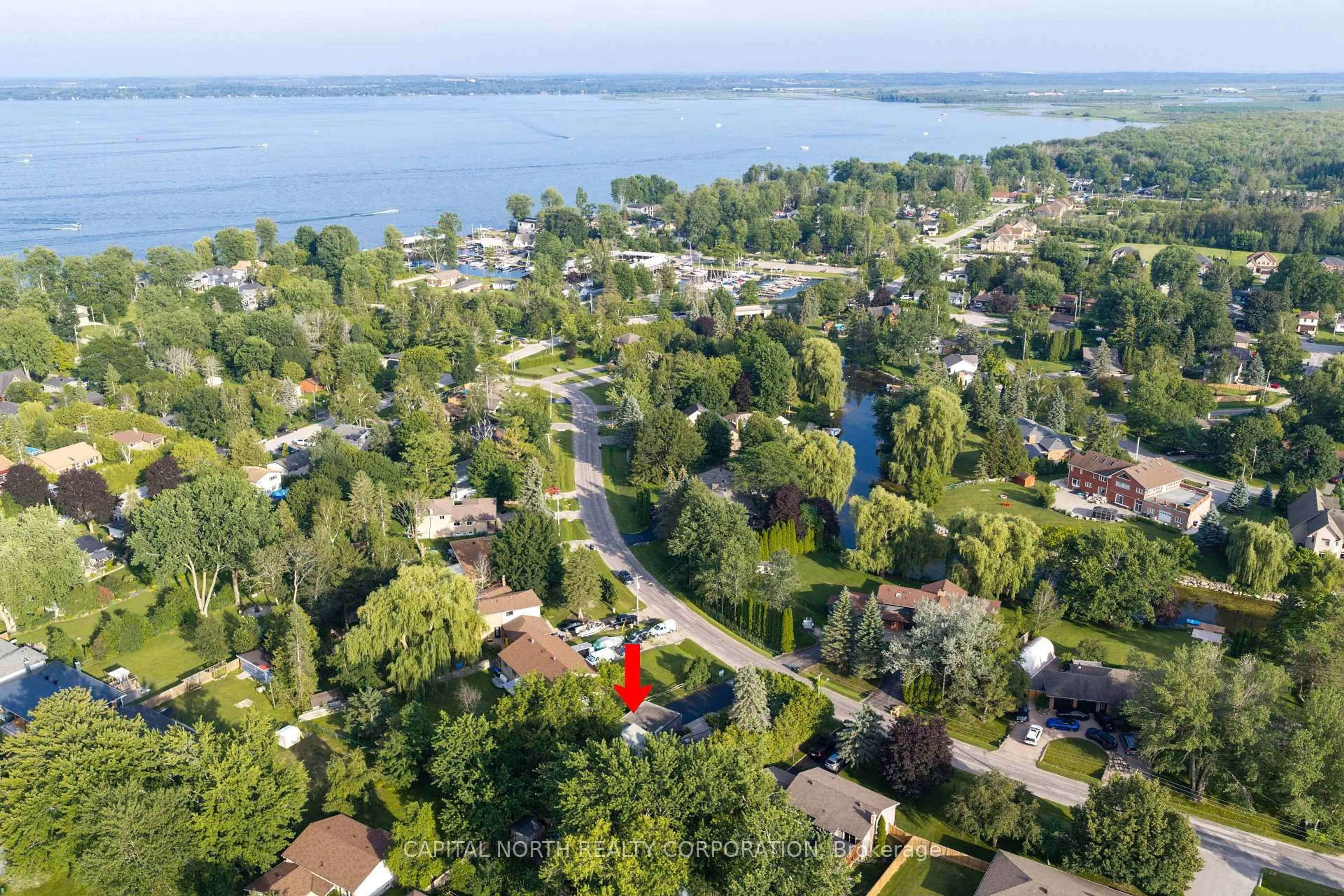 A pic from outside/outdoor area/front of a property/back of a property/a pic from drone, water/lake/river/ocean view for 1166 Parkway Dr, Innisfil Ontario L0L 1R0