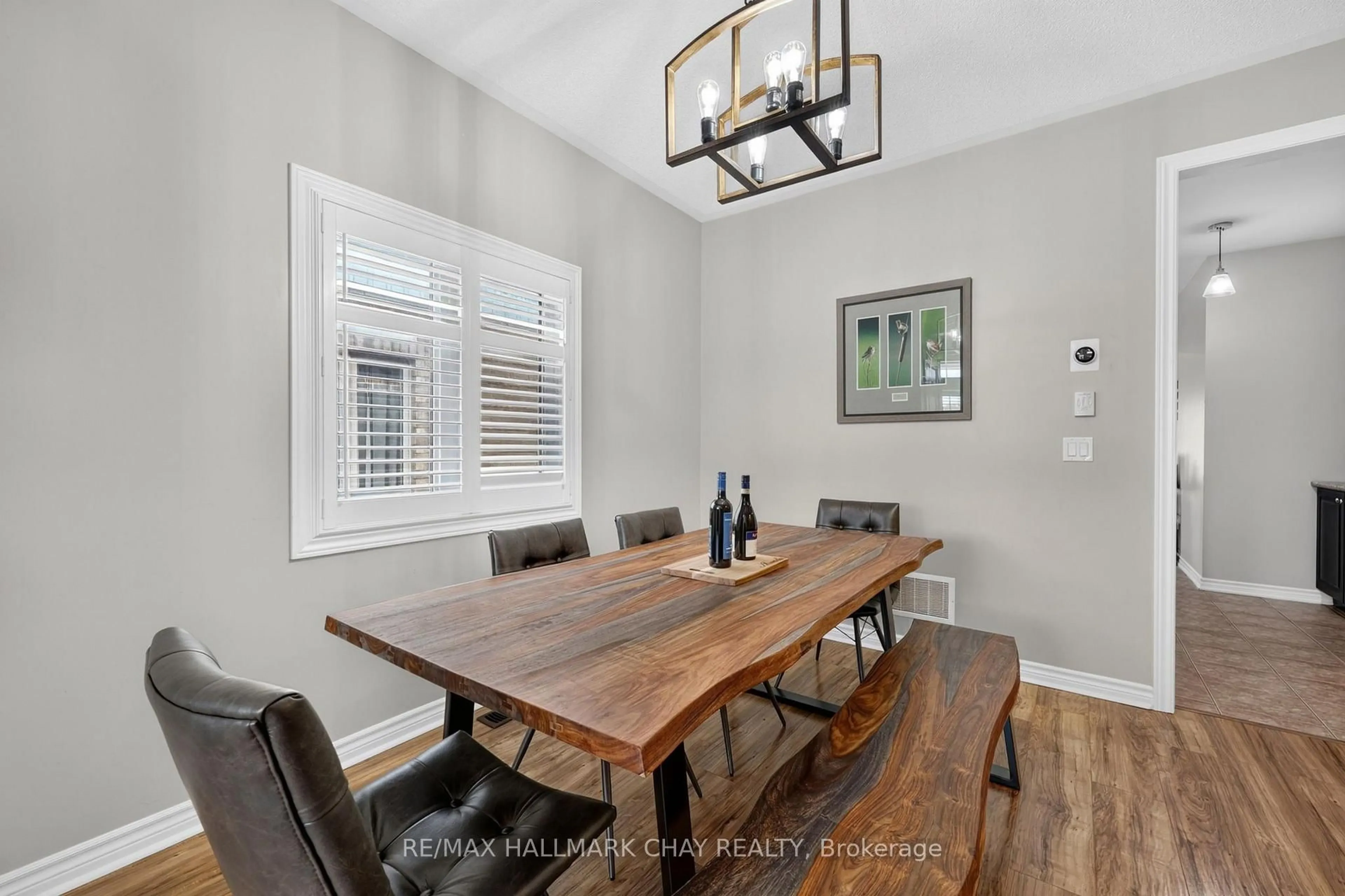 Dining room, wood/laminate floor for 72 Decarolis Cres, Essa Ontario L3W 0B2