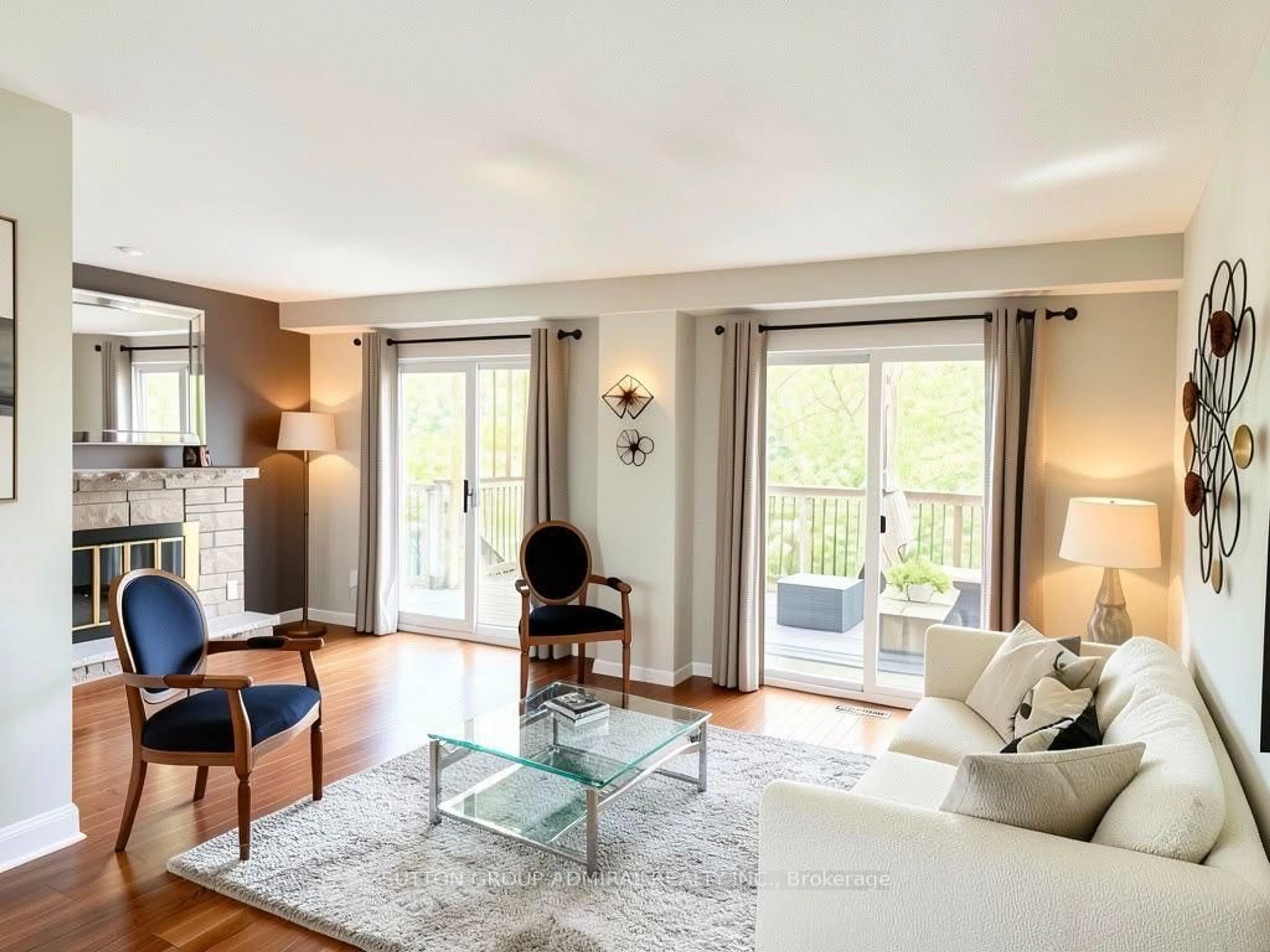Living room with furniture, wood/laminate floor for 19 Backus Crt, Markham Ontario L3P 6V6
