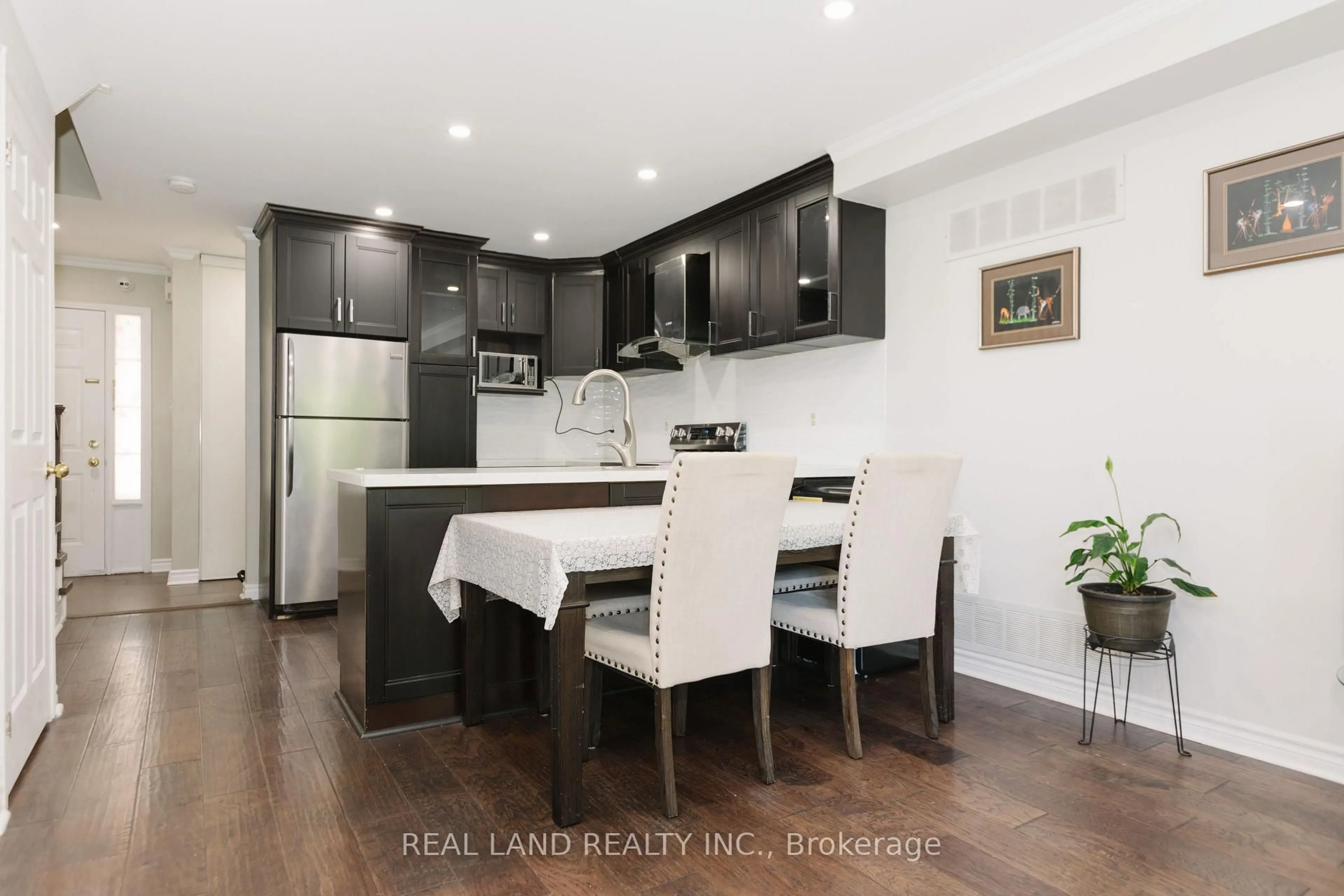 Open concept kitchen, wood/laminate floor for 697 Limpert Terr, Newmarket Ontario L3Y 8R2
