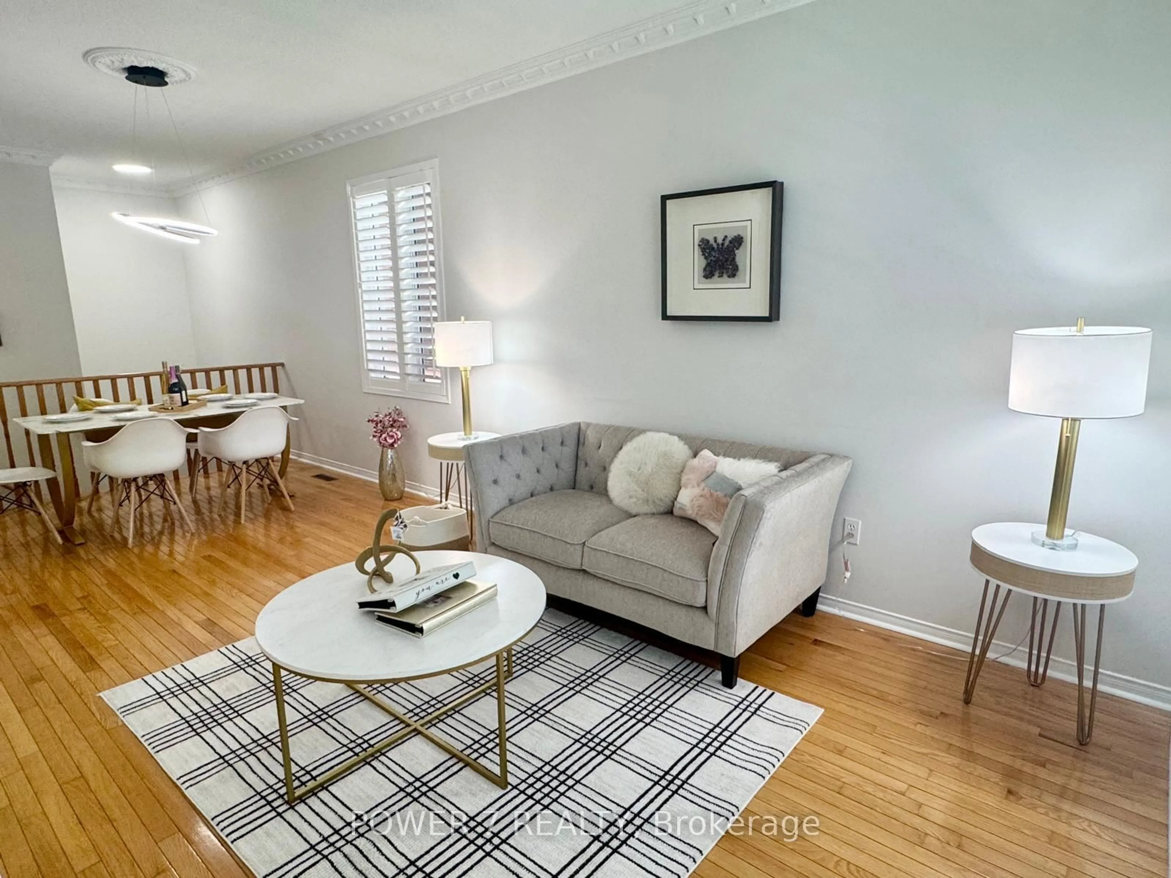 Living room with furniture, wood/laminate floor for 28 Cliveden Pl, Markham Ontario L6C 2S4