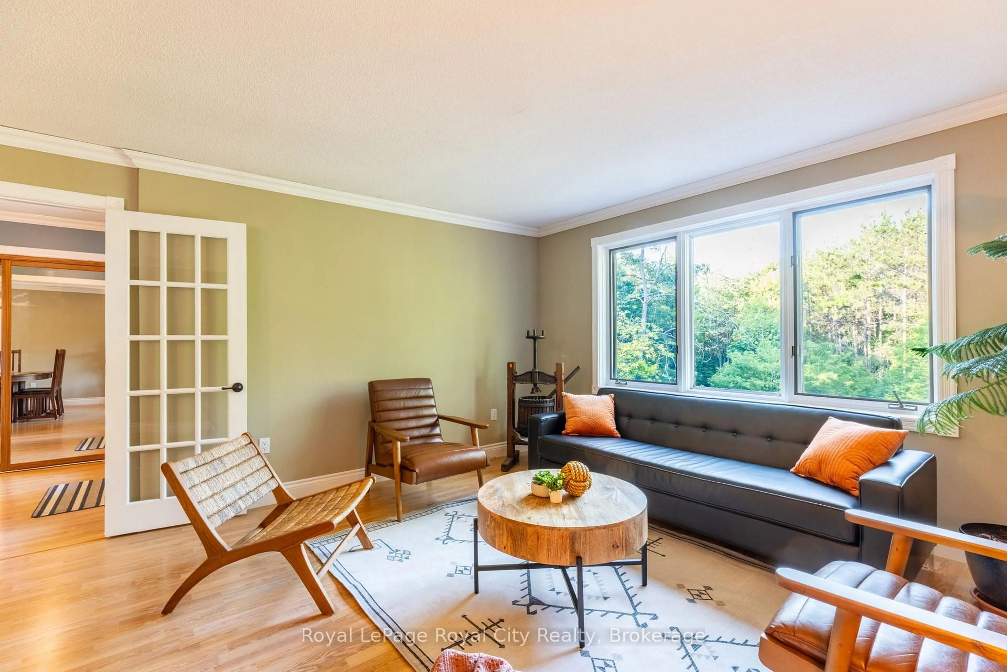 Living room with furniture, wood/laminate floor for 8276 County Road 27 Rd, Essa Ontario L4N 9C4