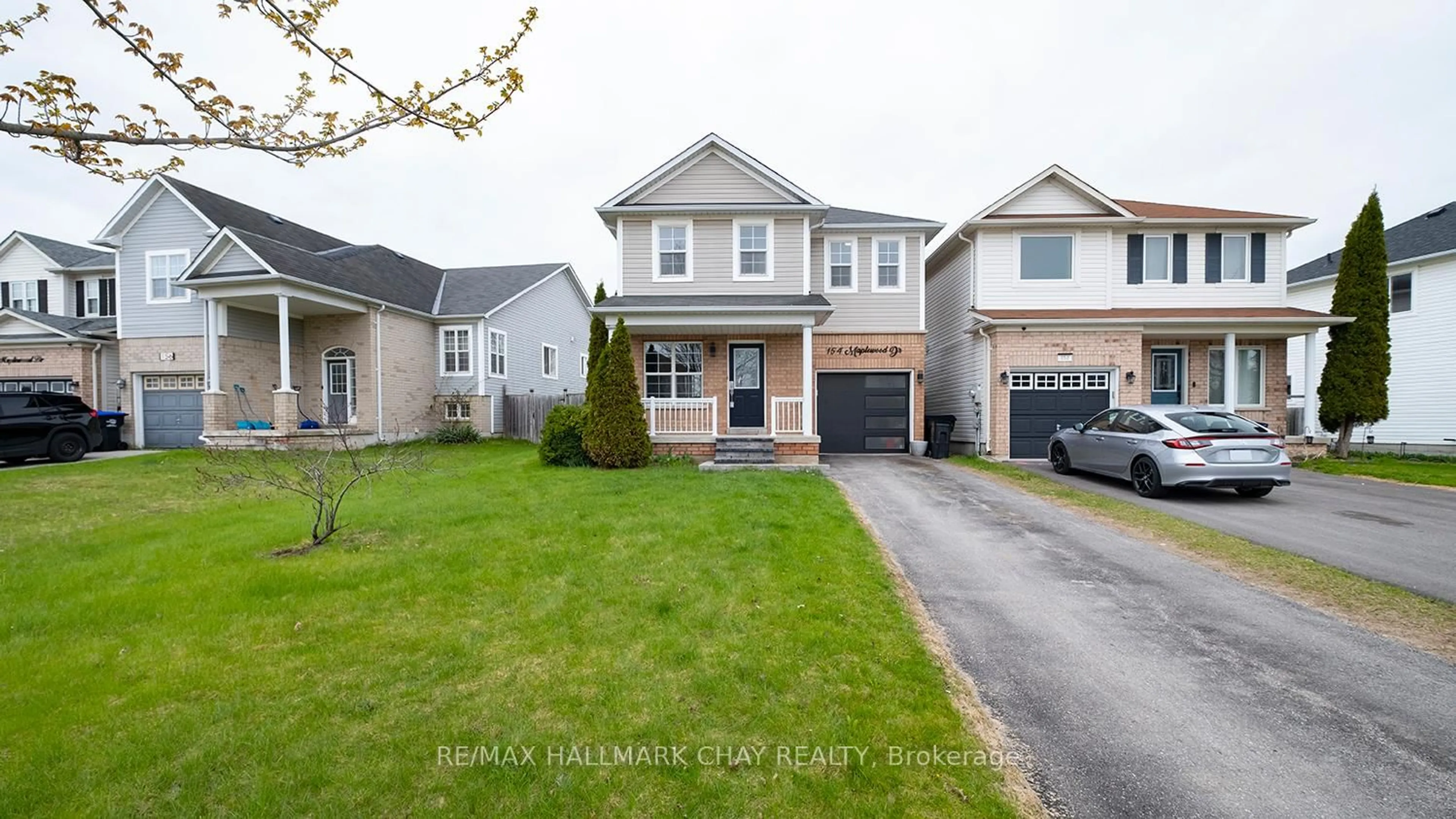 Home with vinyl exterior material, street for 154 Maplewood Dr, Essa Ontario L0M 1B4