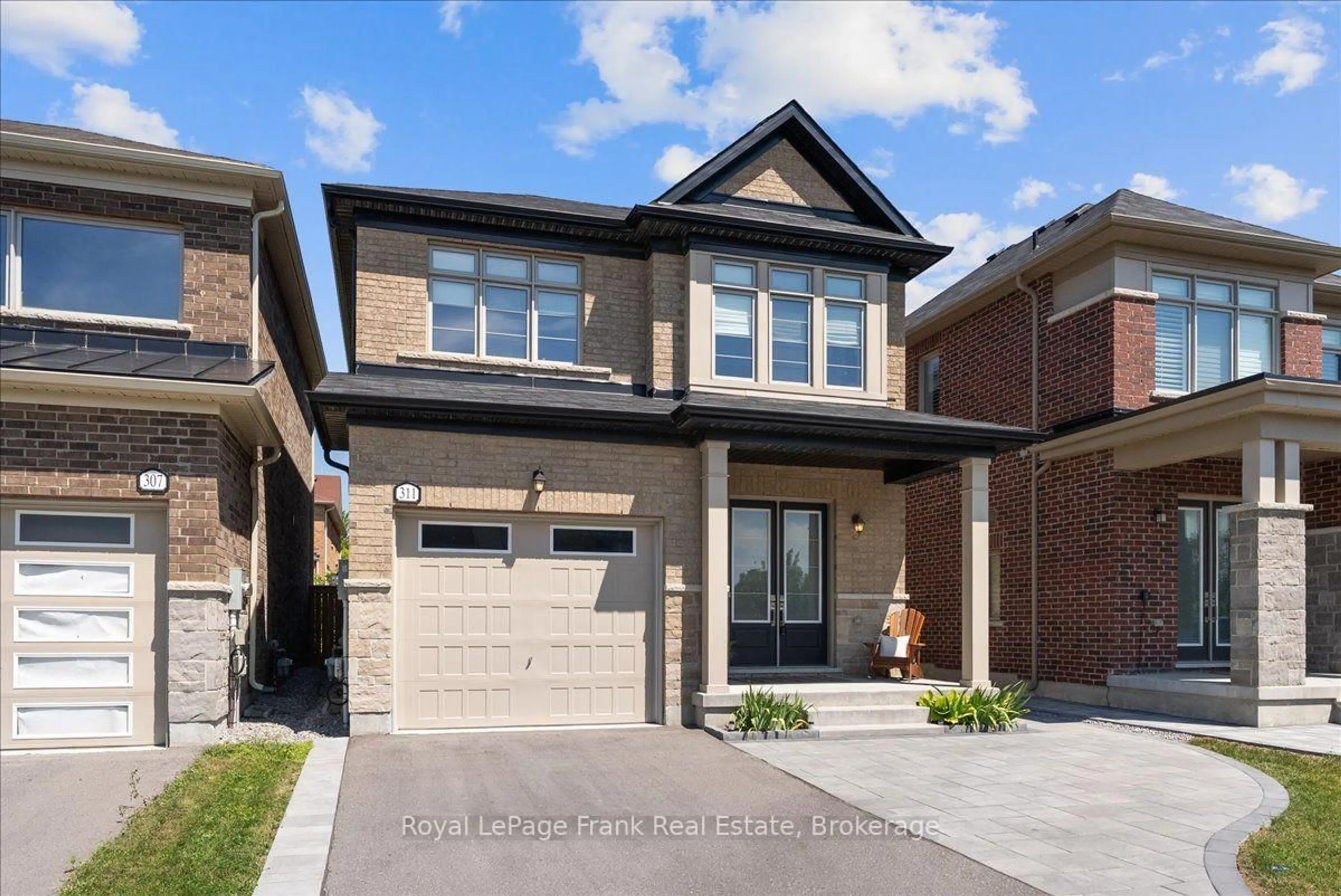 Home with brick exterior material, street for 311 Busato Dr, Whitchurch-Stouffville Ontario L4A 4V1