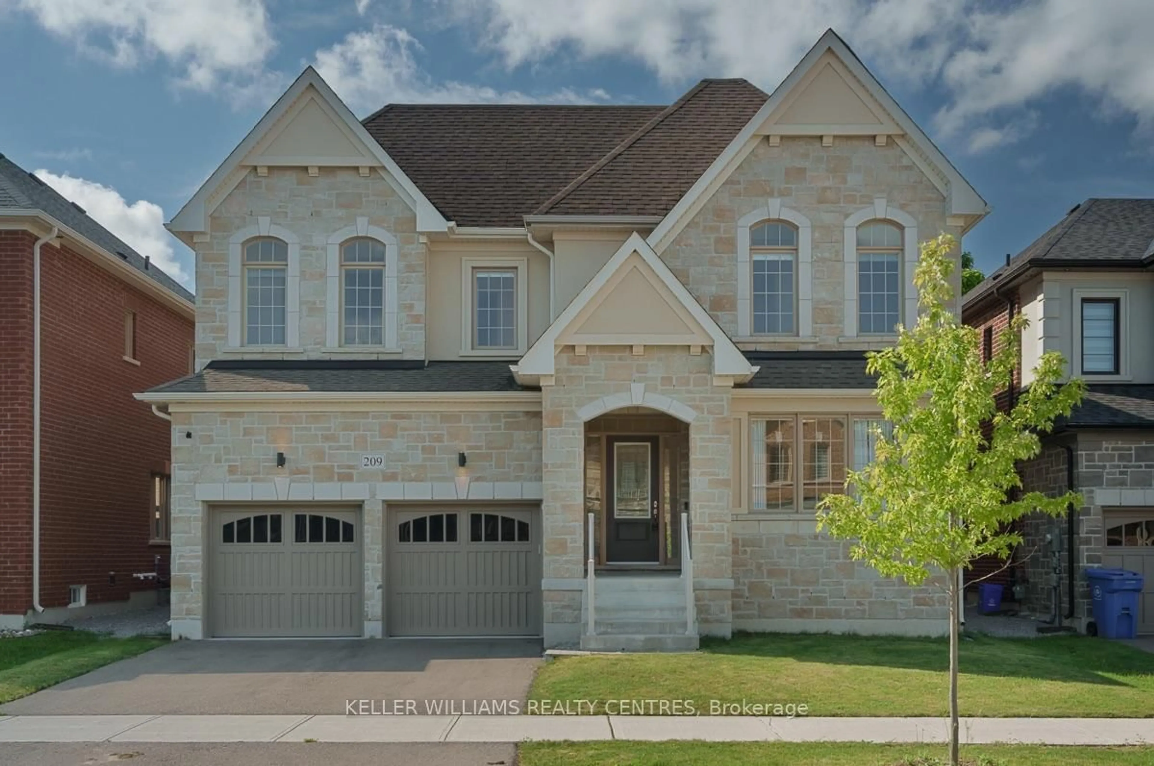 Home with brick exterior material, street for 209 Danny Wheeler Blvd, Georgina Ontario L4P 0J7