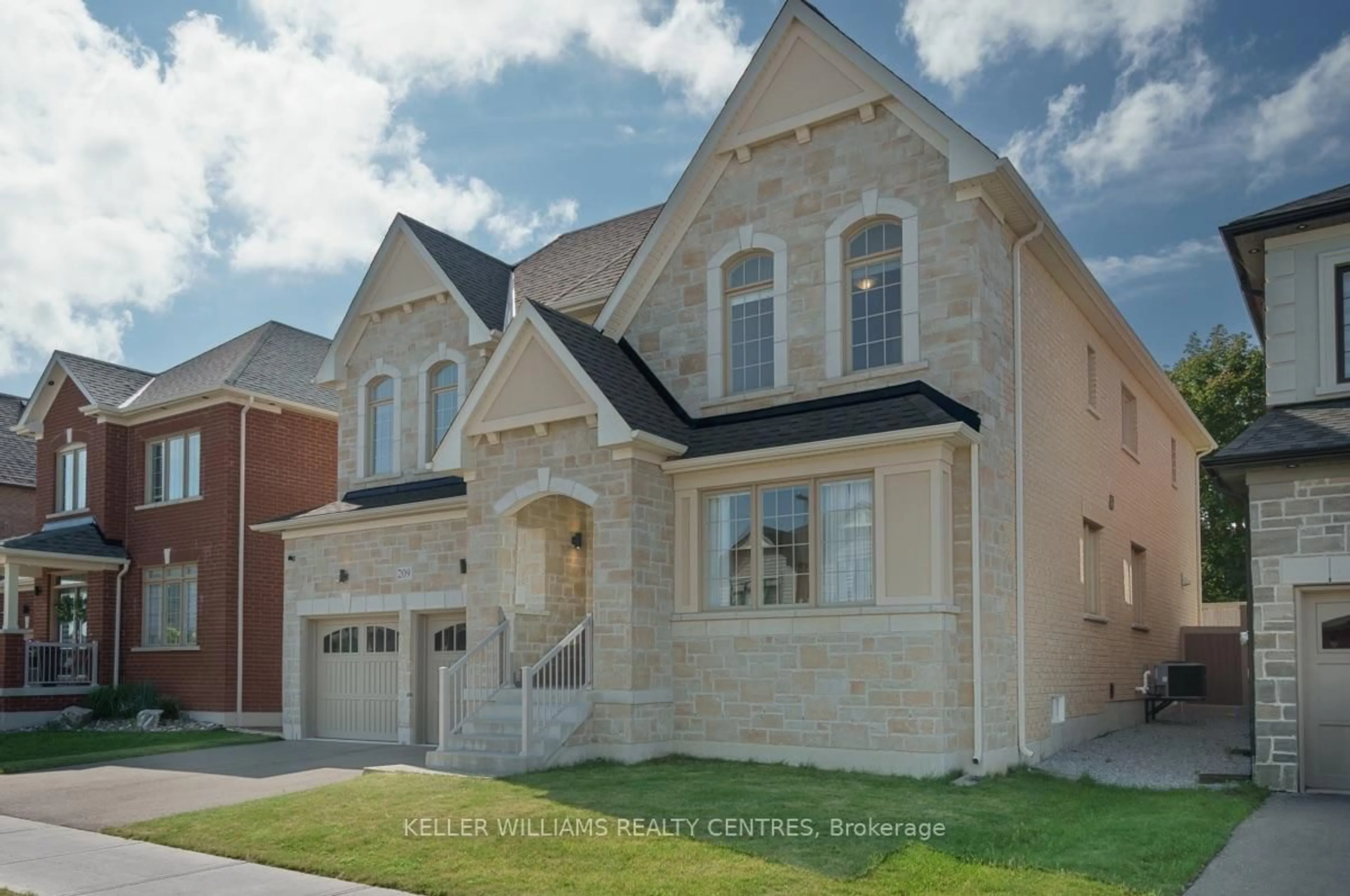 Home with brick exterior material, street for 209 Danny Wheeler Blvd, Georgina Ontario L4P 0J7