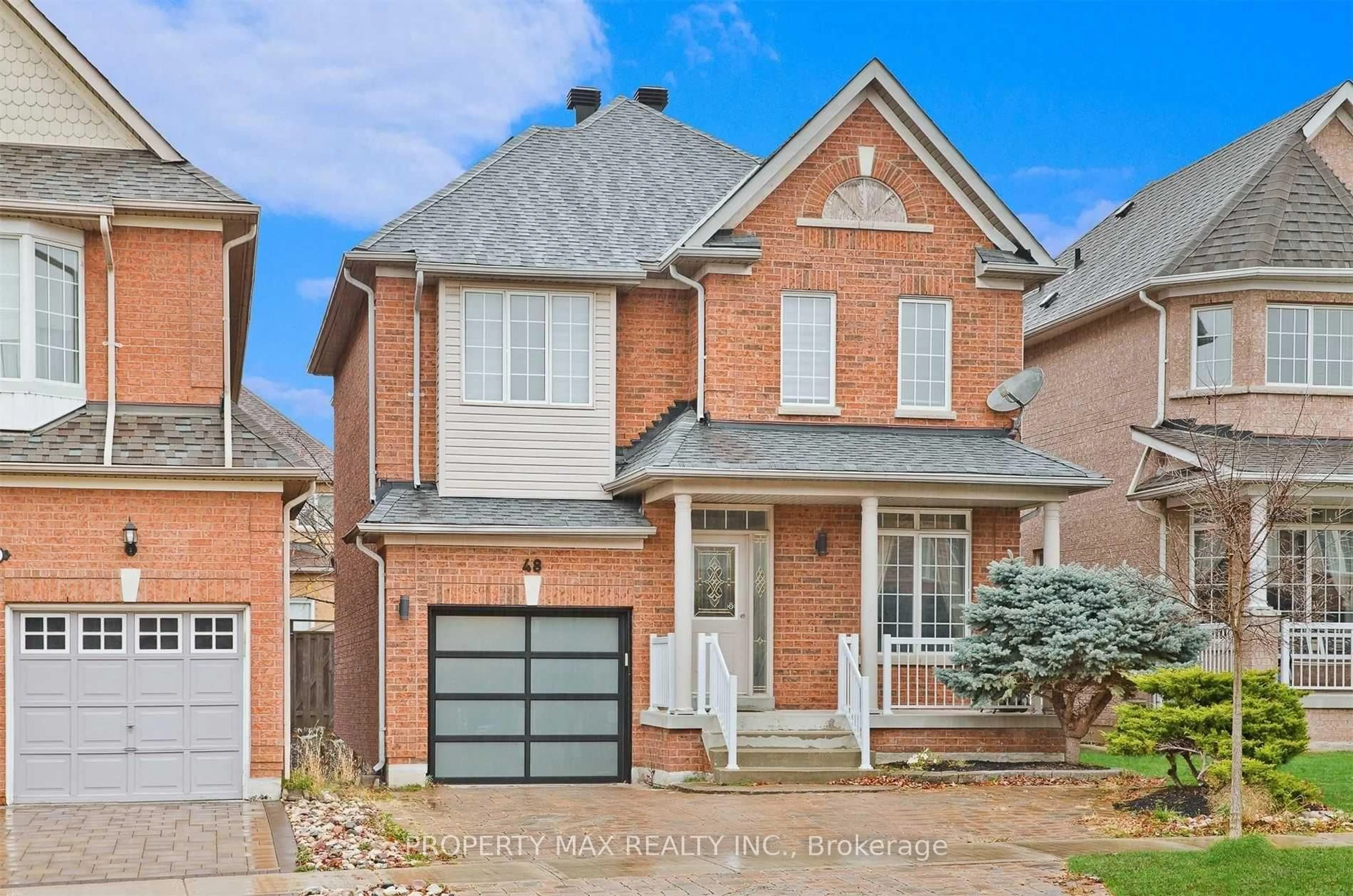 Home with brick exterior material, street for 48 Elmrill Rd, Markham Ontario L6C 2P1
