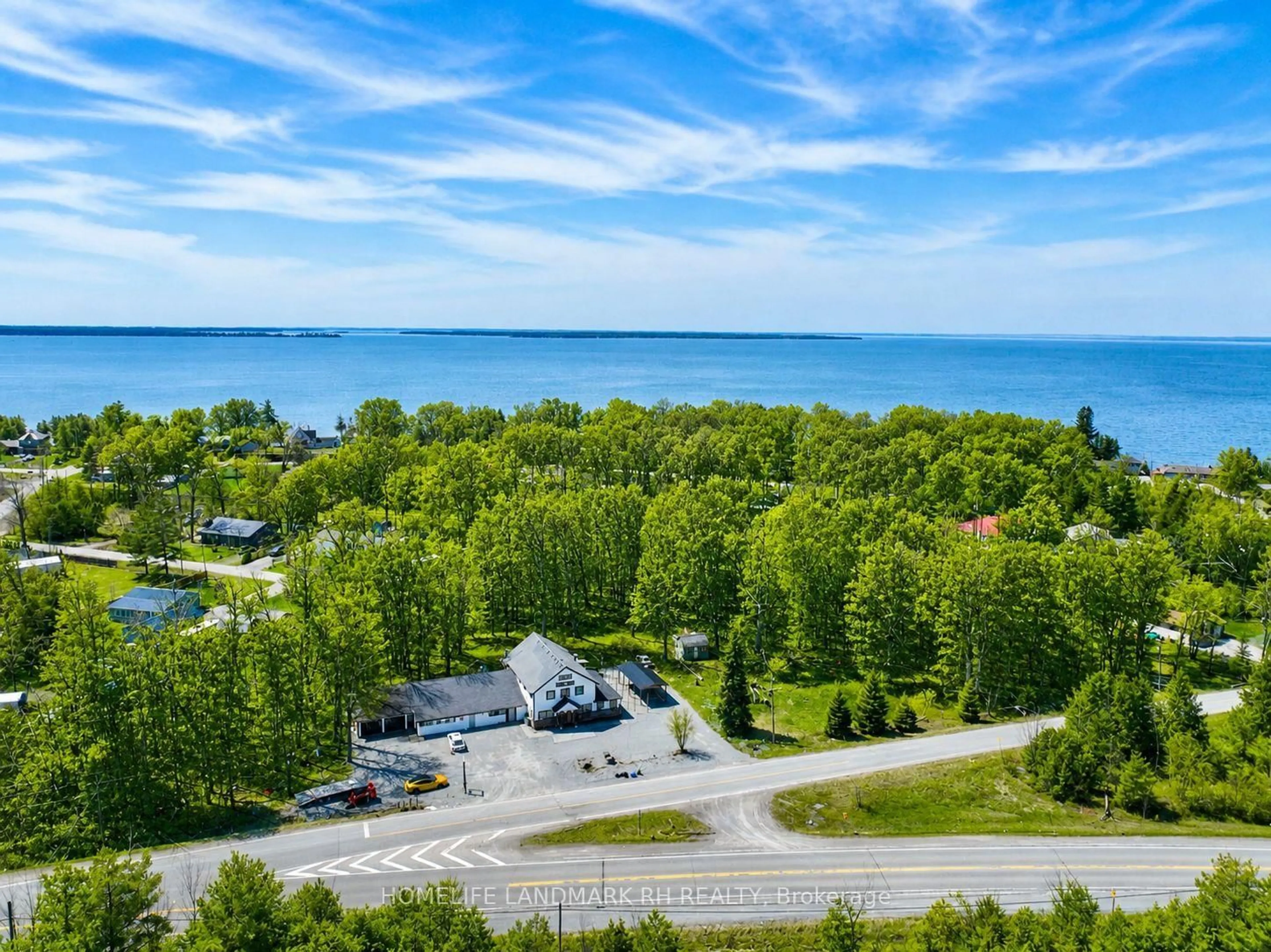 A pic from outside/outdoor area/front of a property/back of a property/a pic from drone, water/lake/river/ocean view for 25066 Commodore Rd, Brock Ontario L0K 1A0