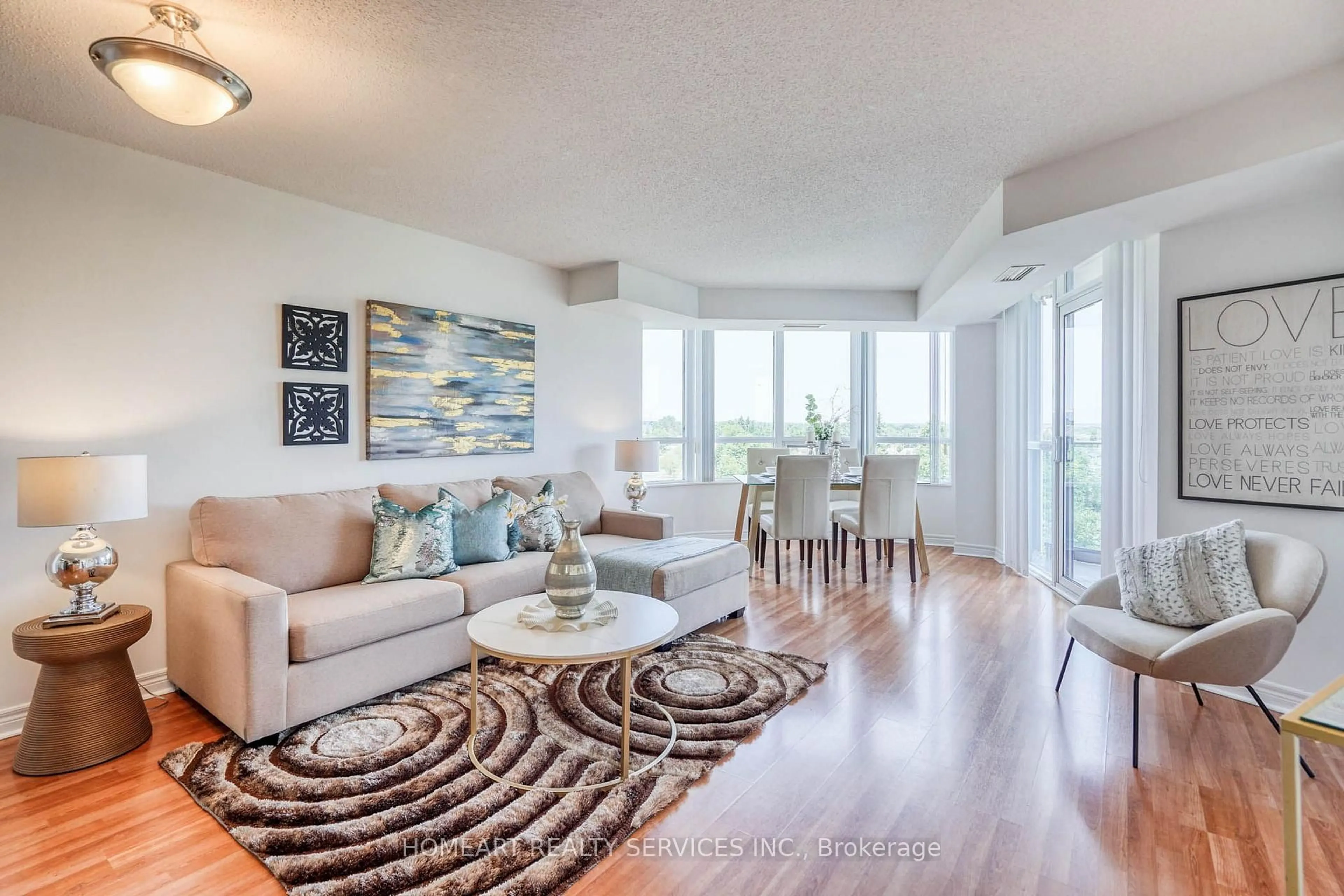 Living room with furniture, wood/laminate floor for 33 Cox Blvd #722, Markham Ontario L3R 8A6