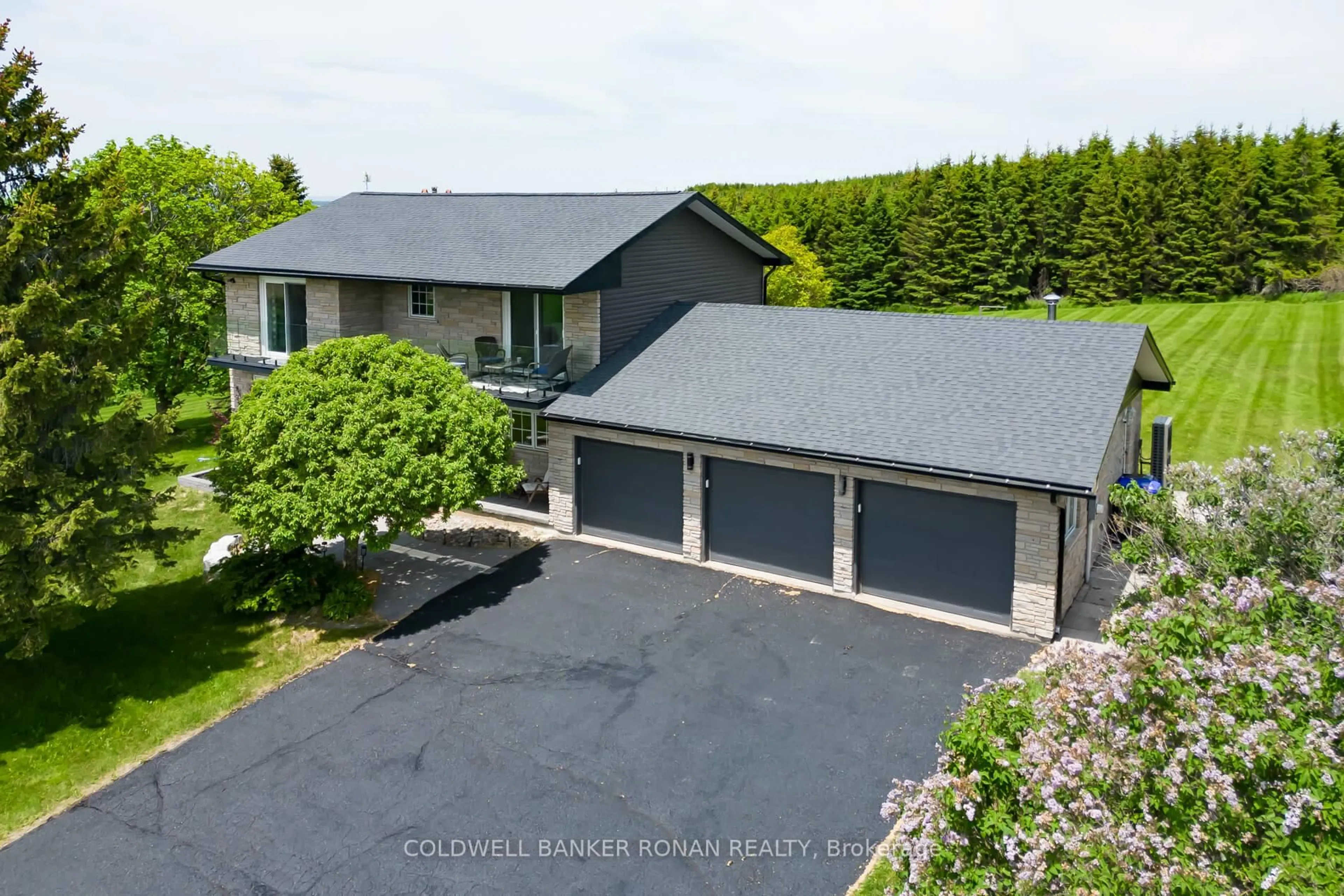 A pic from outside/outdoor area/front of a property/back of a property/a pic from drone, street for 5676 14th Line, New Tecumseth Ontario L0L 1L0