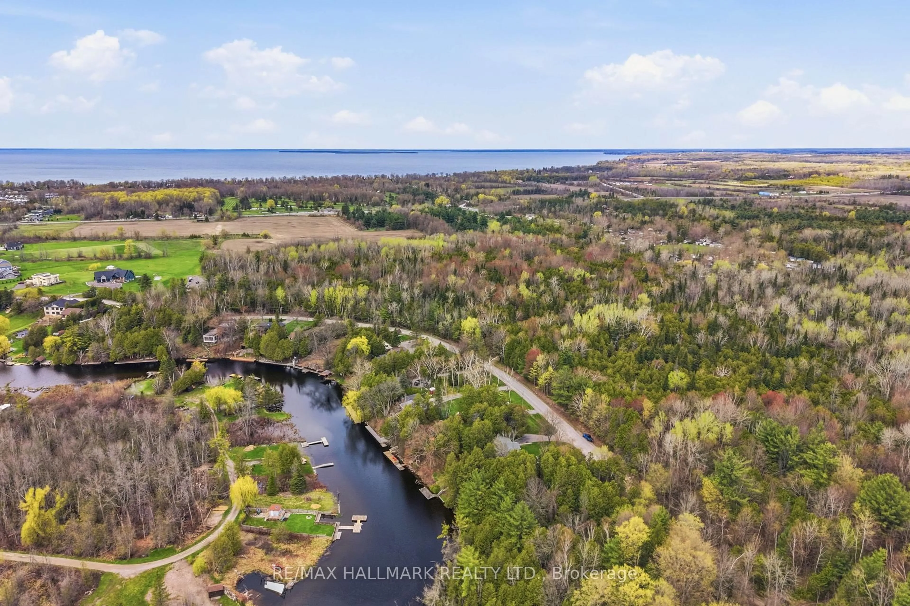 A pic from outside/outdoor area/front of a property/back of a property/a pic from drone, water/lake/river/ocean view for 104 Riverbank Dr, Georgina Ontario L0E 1N0