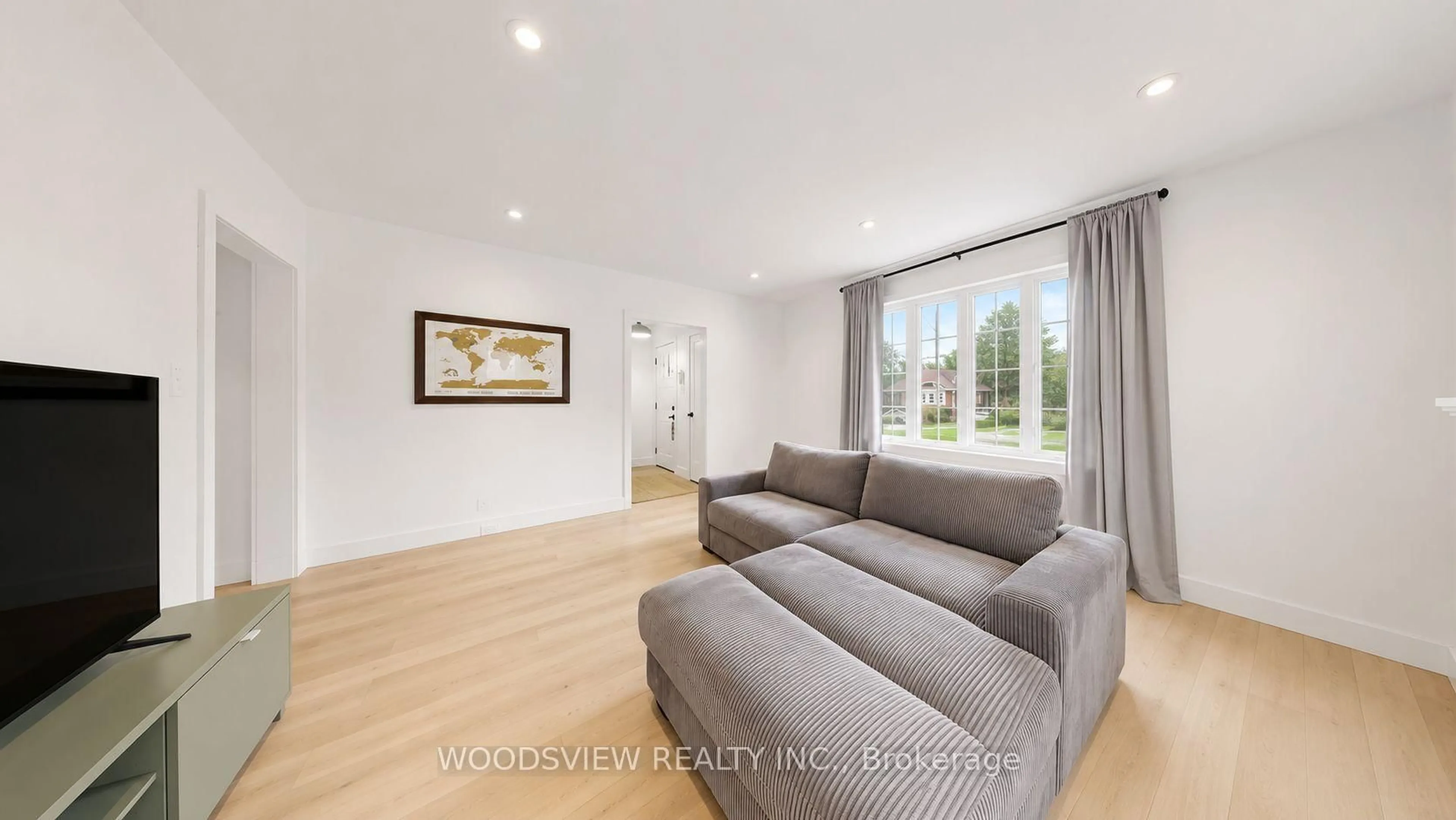 Living room with furniture, wood/laminate floor for 388 Eagle St, Newmarket Ontario L3Y 1K4