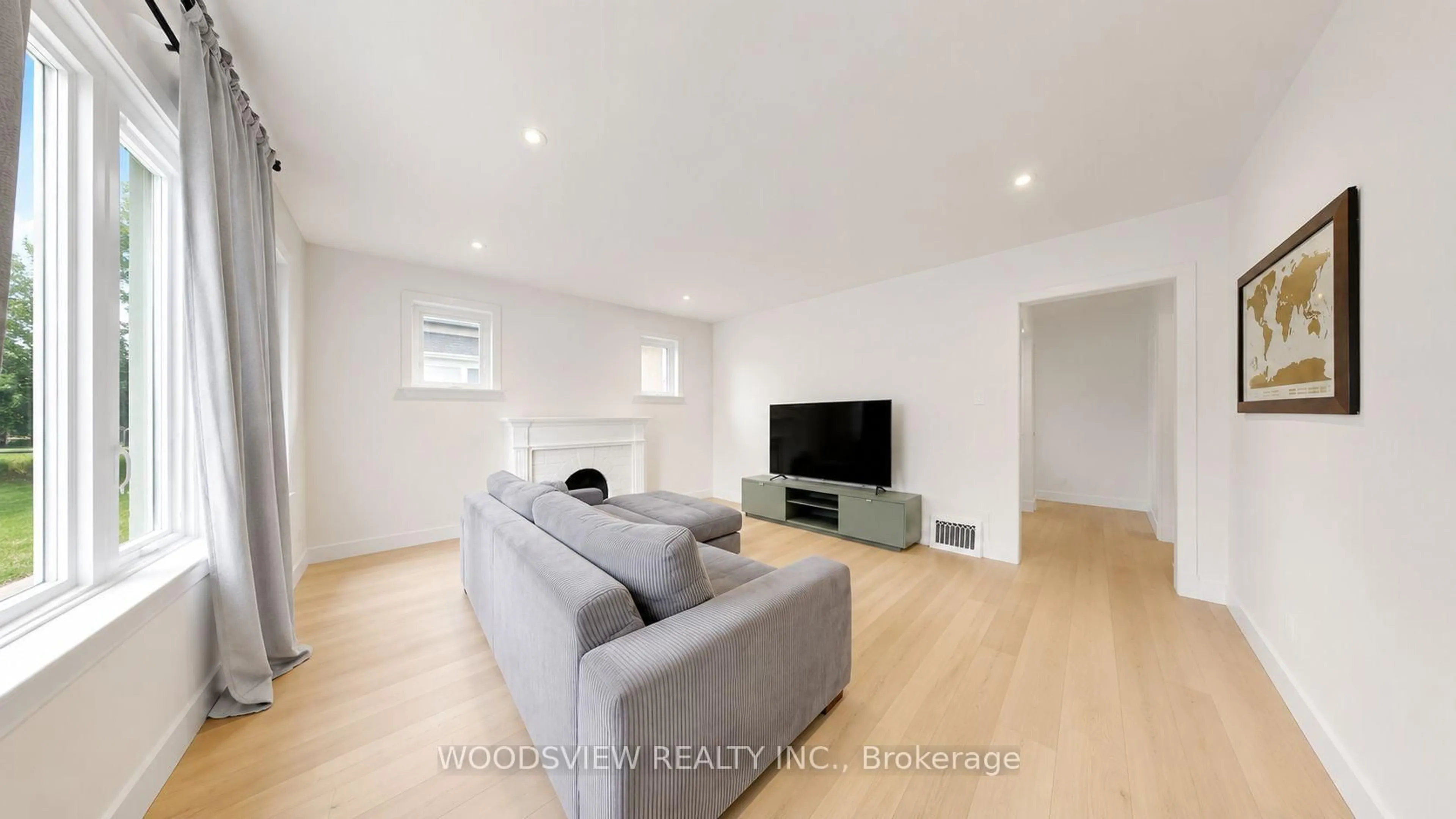 Living room with furniture, wood/laminate floor for 388 Eagle St, Newmarket Ontario L3Y 1K4