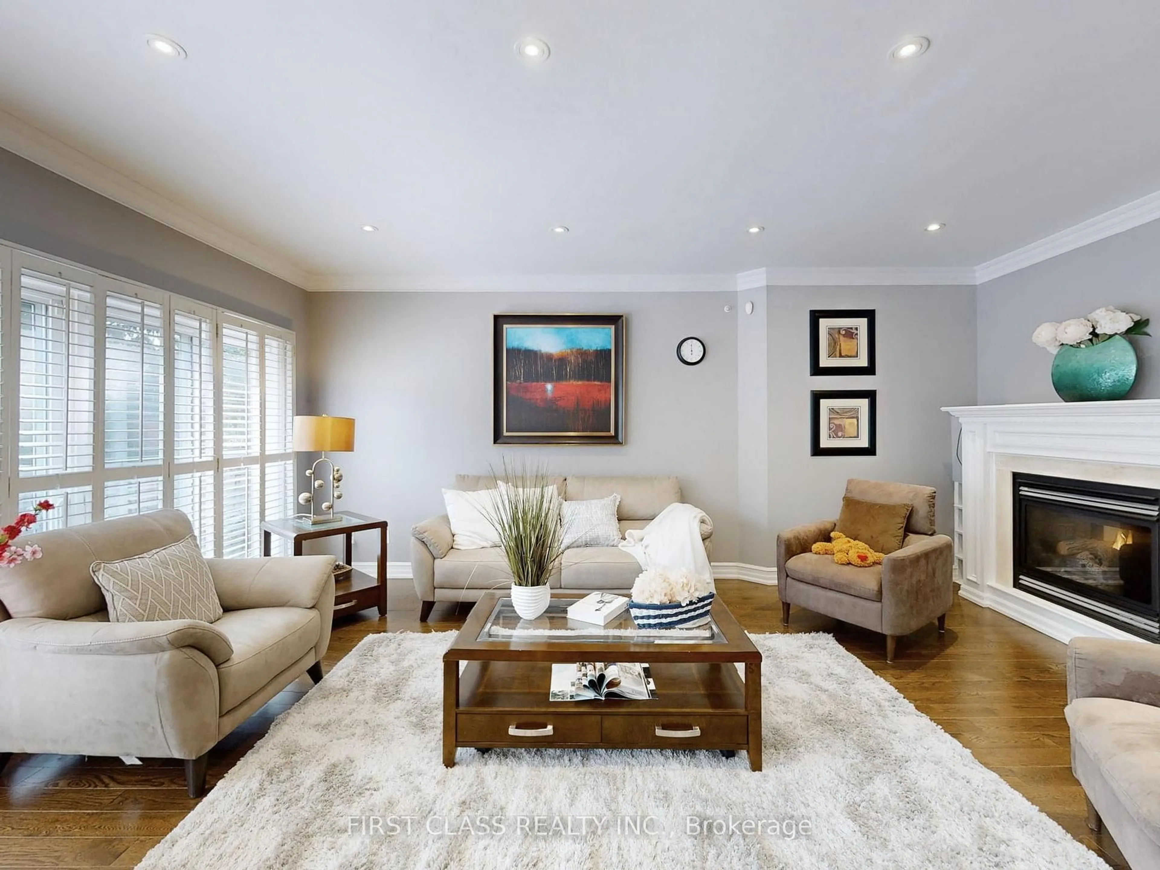 Living room with furniture, wood/laminate floor for 125 Longwater Chse, Markham Ontario L3R 4A9