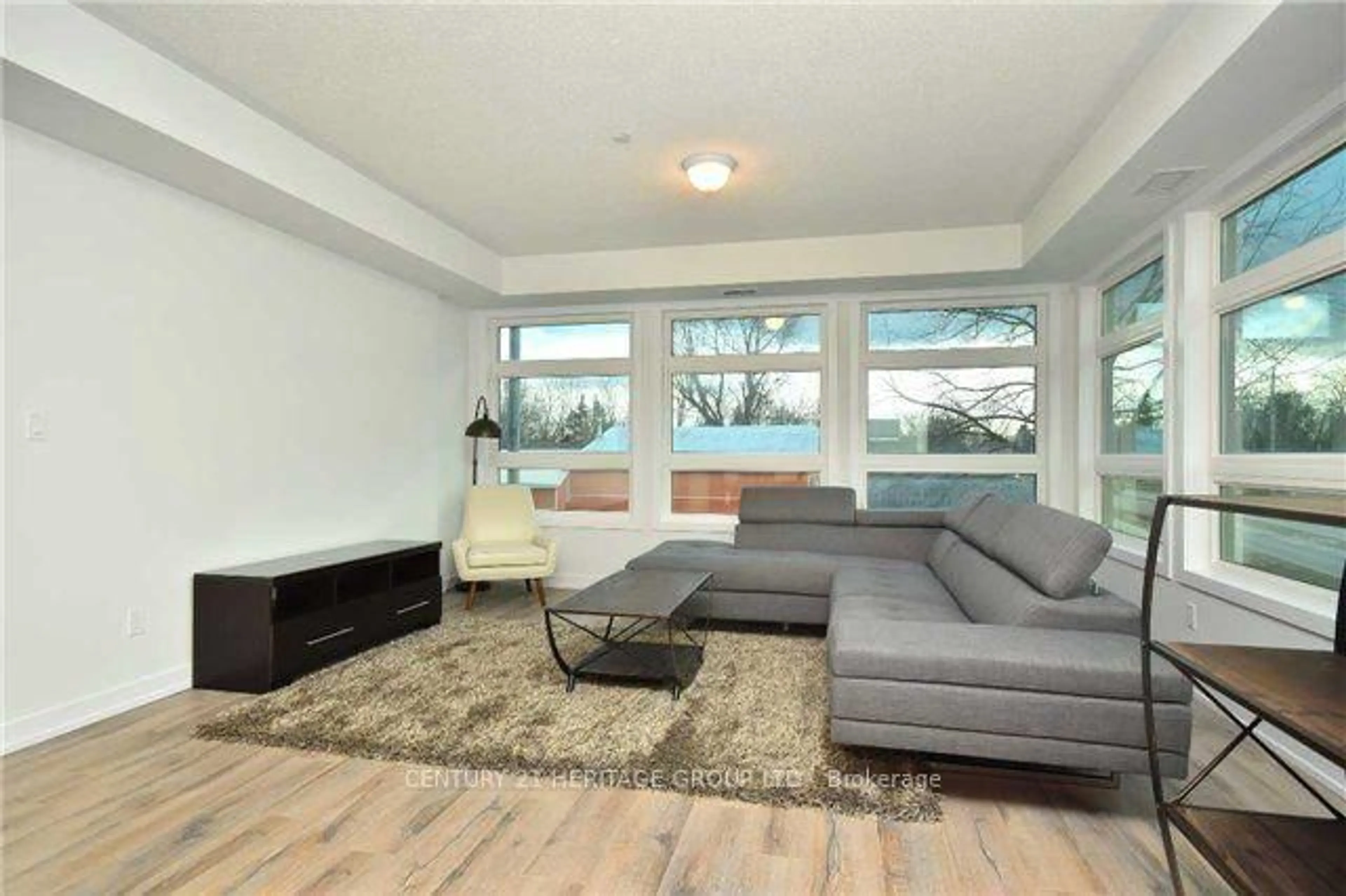 Living room with furniture, unknown for 69 Boyne St #212, New Tecumseth Ontario L9R 1T3