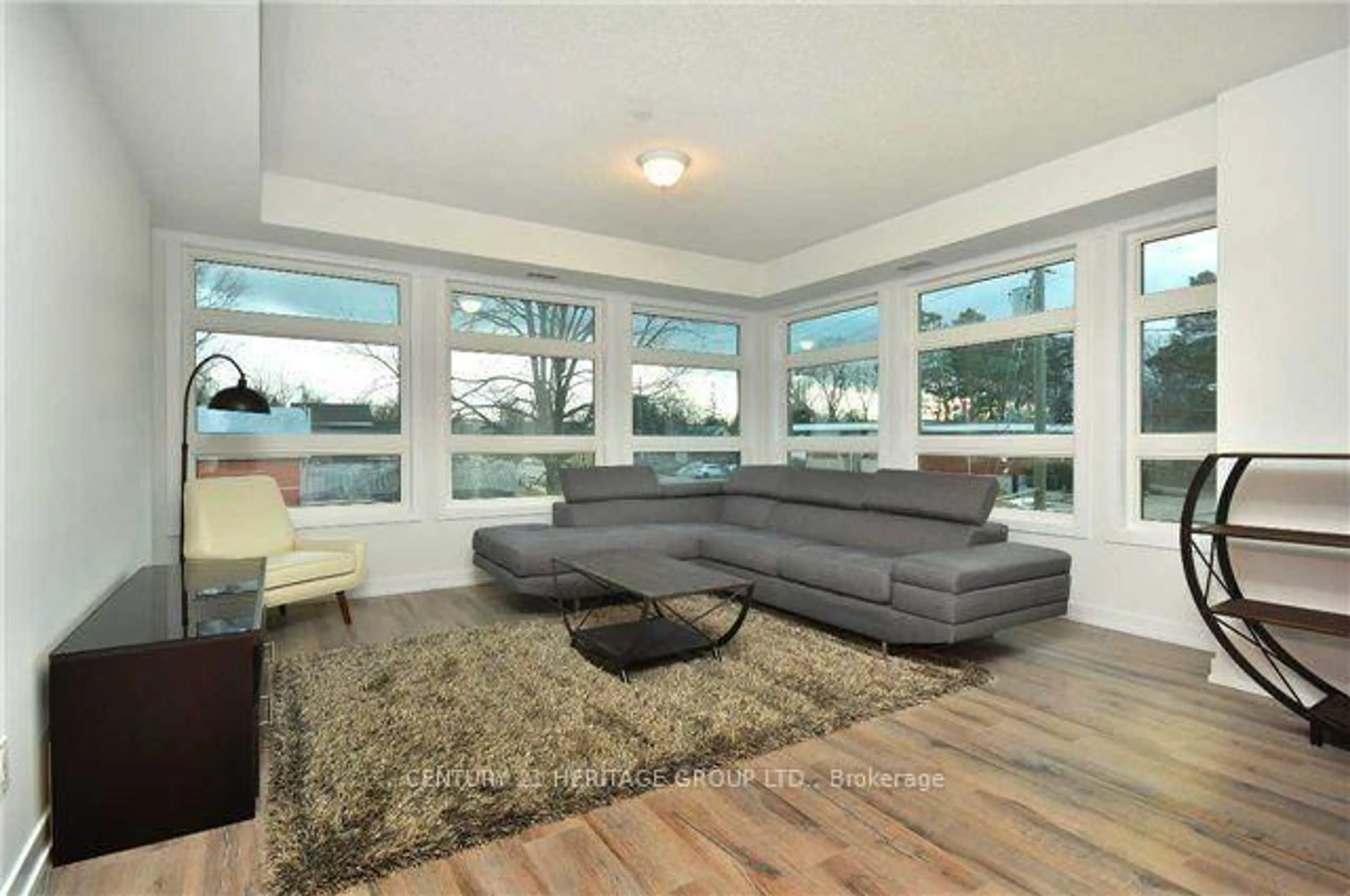 Living room with furniture, unknown for 69 Boyne St #212, New Tecumseth Ontario L9R 1T3