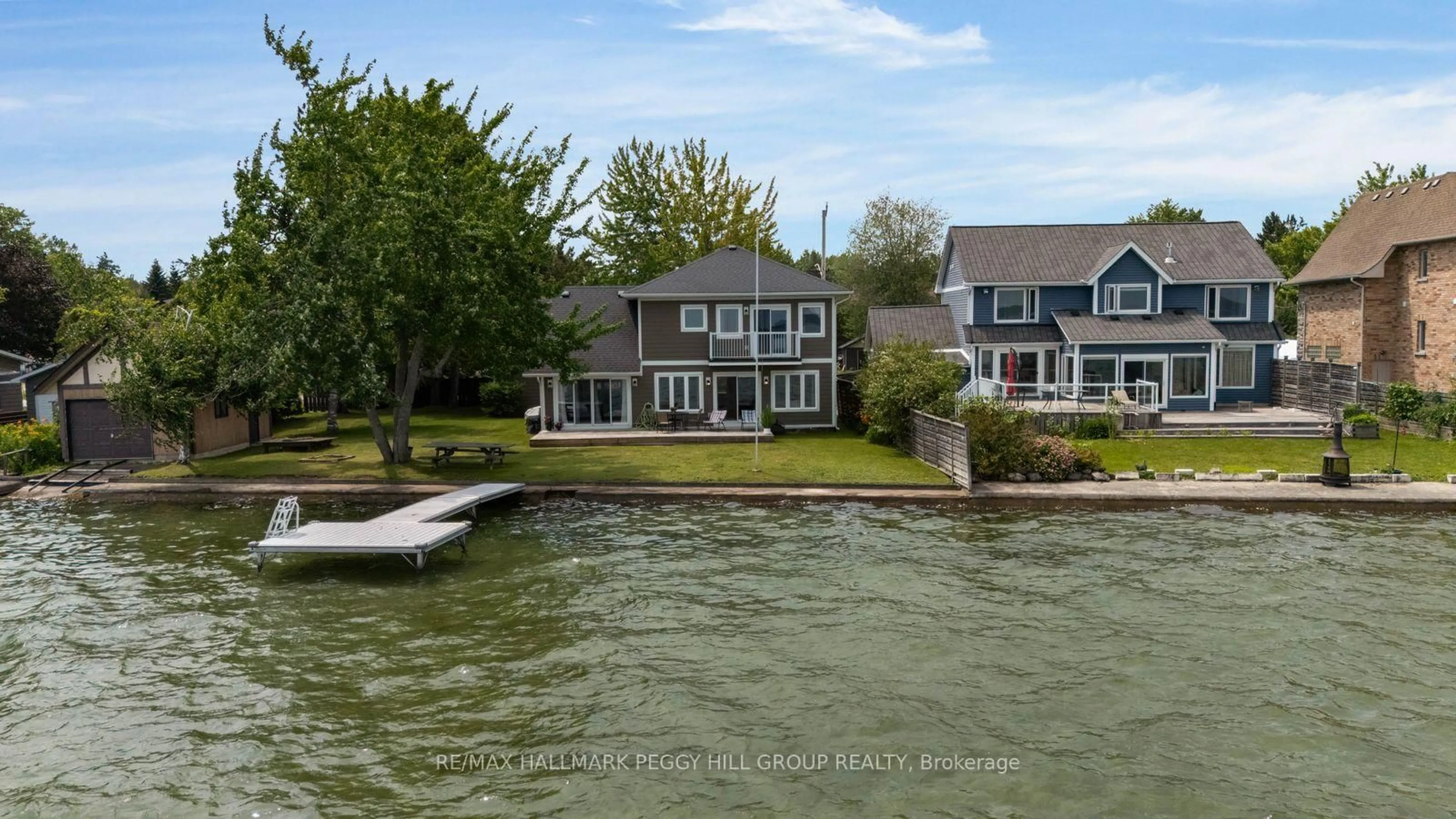 A pic from outside/outdoor area/front of a property/back of a property/a pic from drone, water/lake/river/ocean view for 2261 Crystal Beach Rd, Innisfil Ontario L9S 3W8