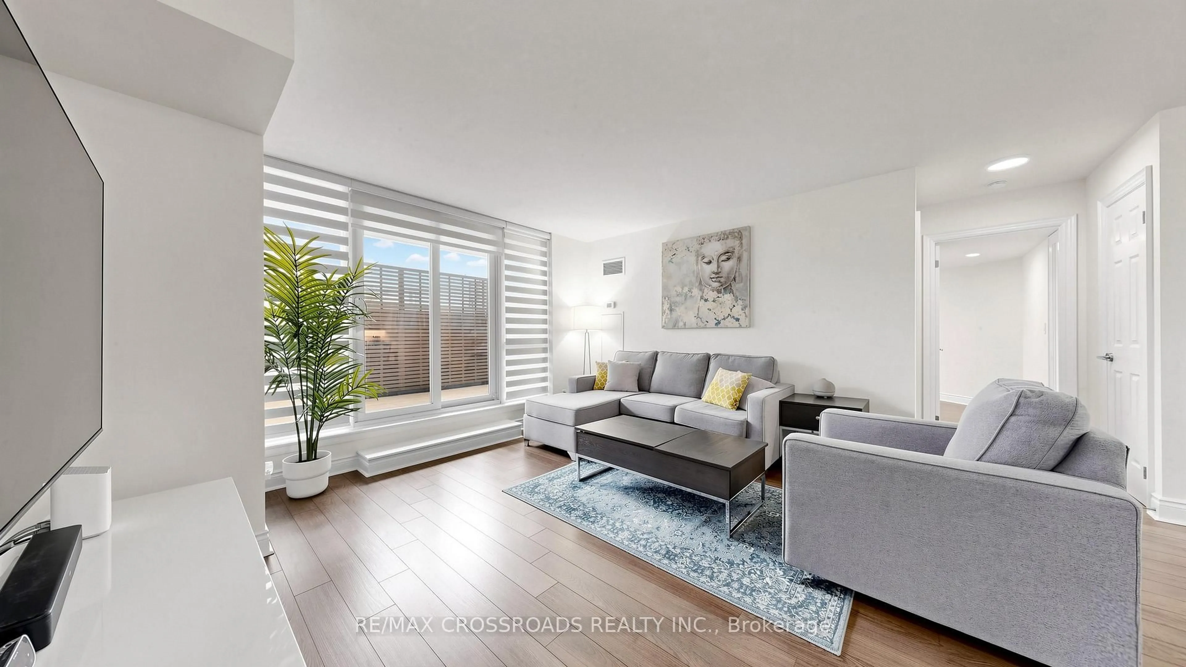Living room with furniture, wood/laminate floor for 23 Cox Blvd #656, Markham Ontario L3R 4G1