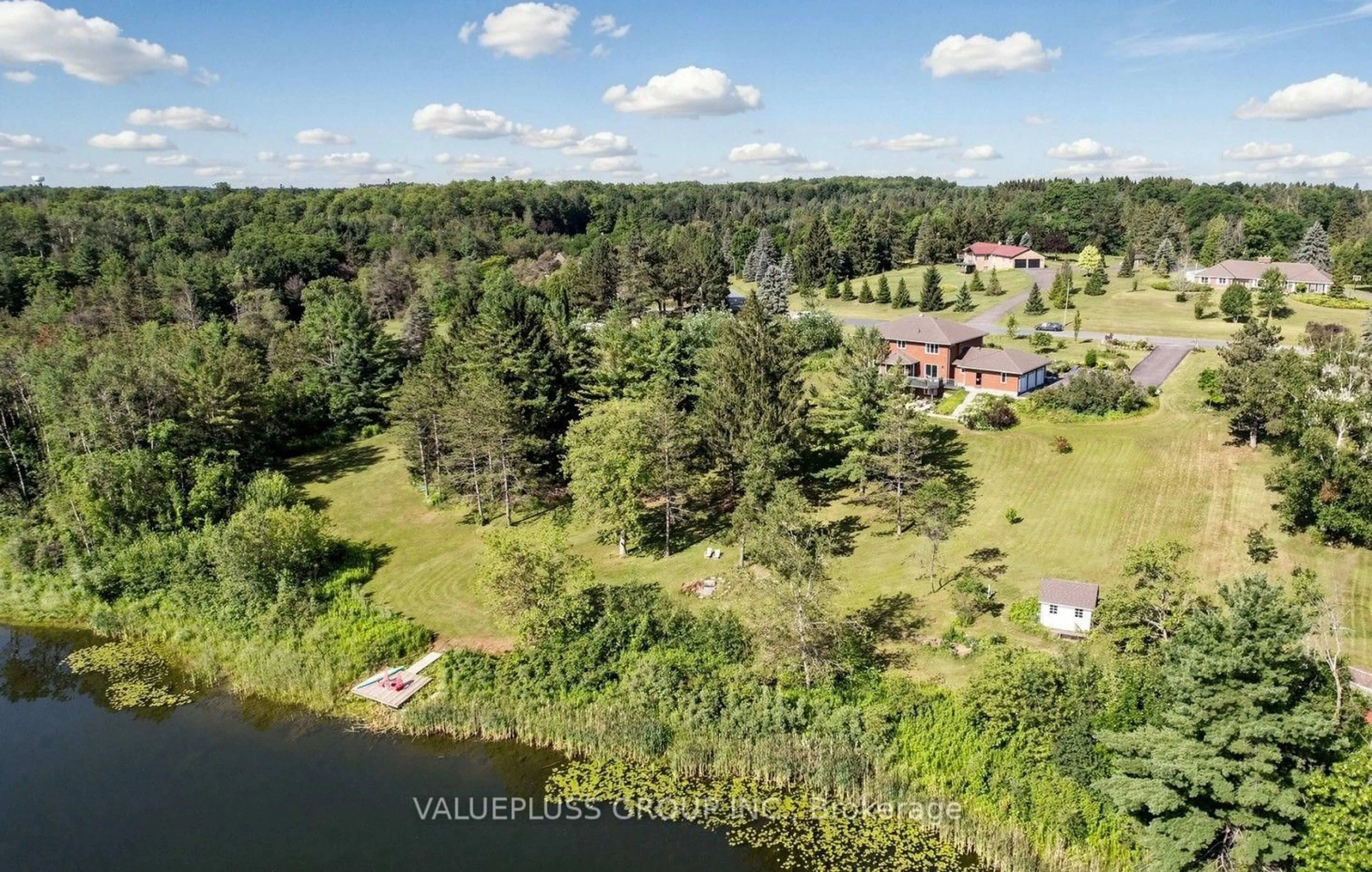 A pic from outside/outdoor area/front of a property/back of a property/a pic from drone, water/lake/river/ocean view for 9 Island Lake Dr, Whitchurch-Stouffville Ontario L4A 7X4