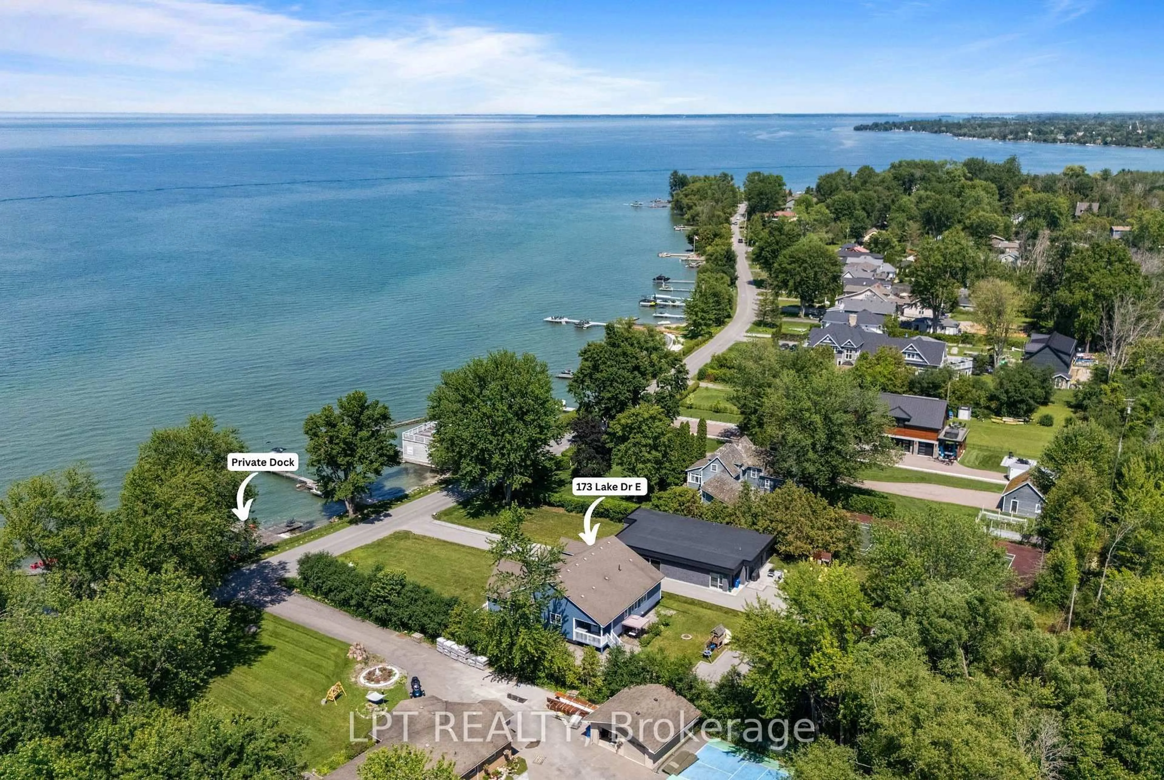 A pic from outside/outdoor area/front of a property/back of a property/a pic from drone, water/lake/river/ocean view for 173 Lake Dr, Georgina Ontario L4P 3E9