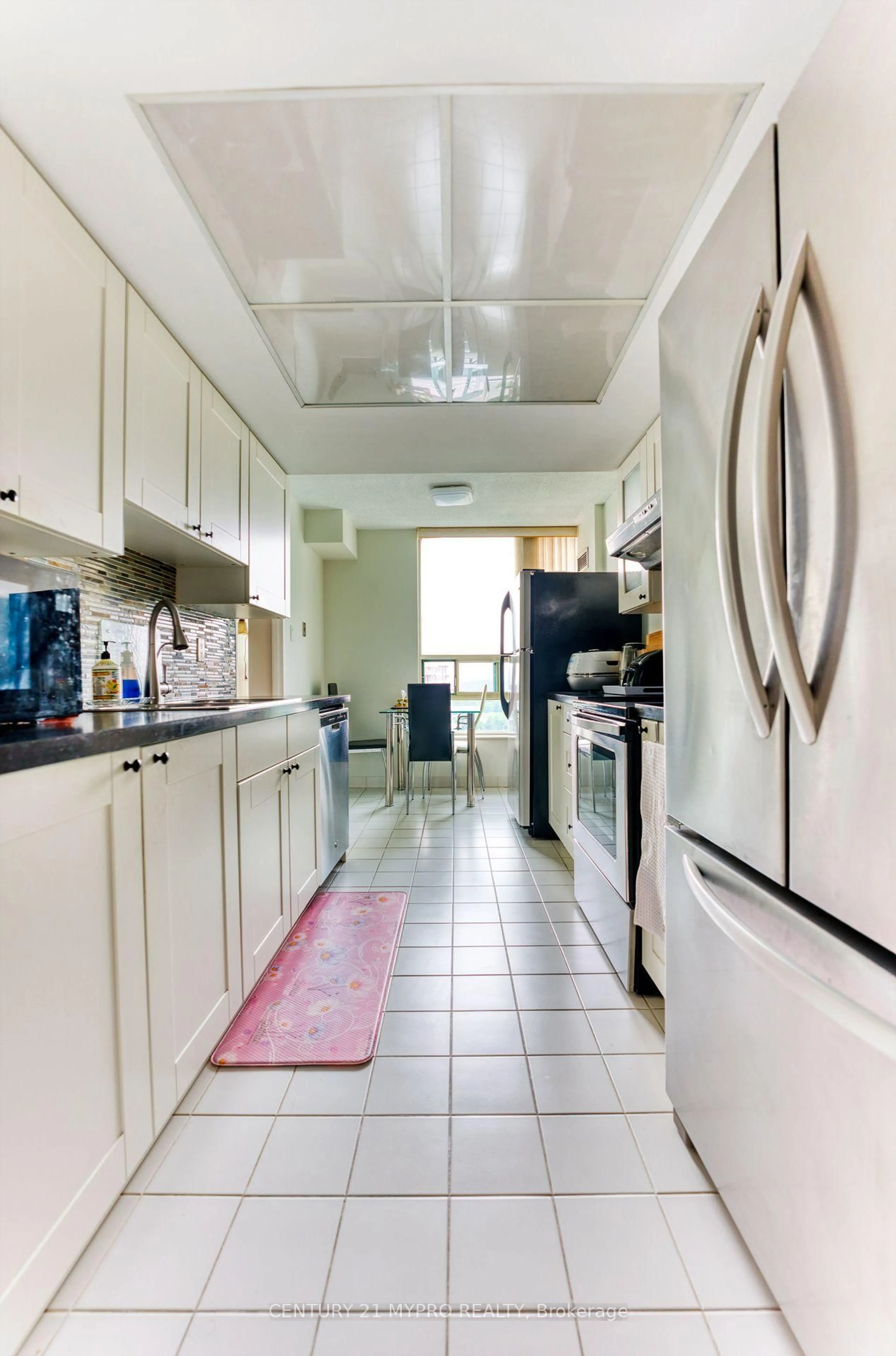 Kitchen with laundary machines, ceramic/tile floor for 7805 Bayview Ave ##1325, Markham Ontario L3T 7N1