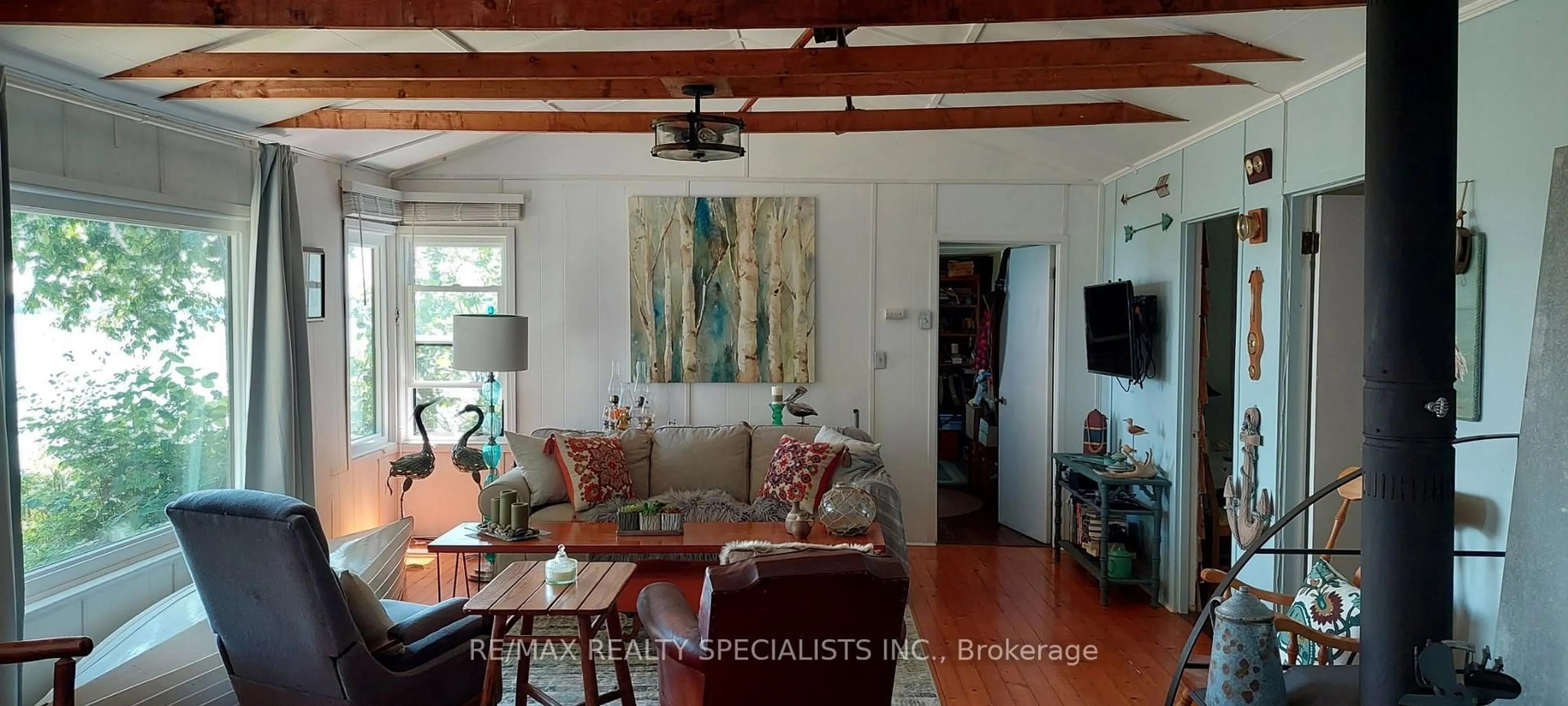 Living room with furniture, wood/laminate floor for LOT 44 Snake Island, Georgina Islands Ontario L4P 3E9