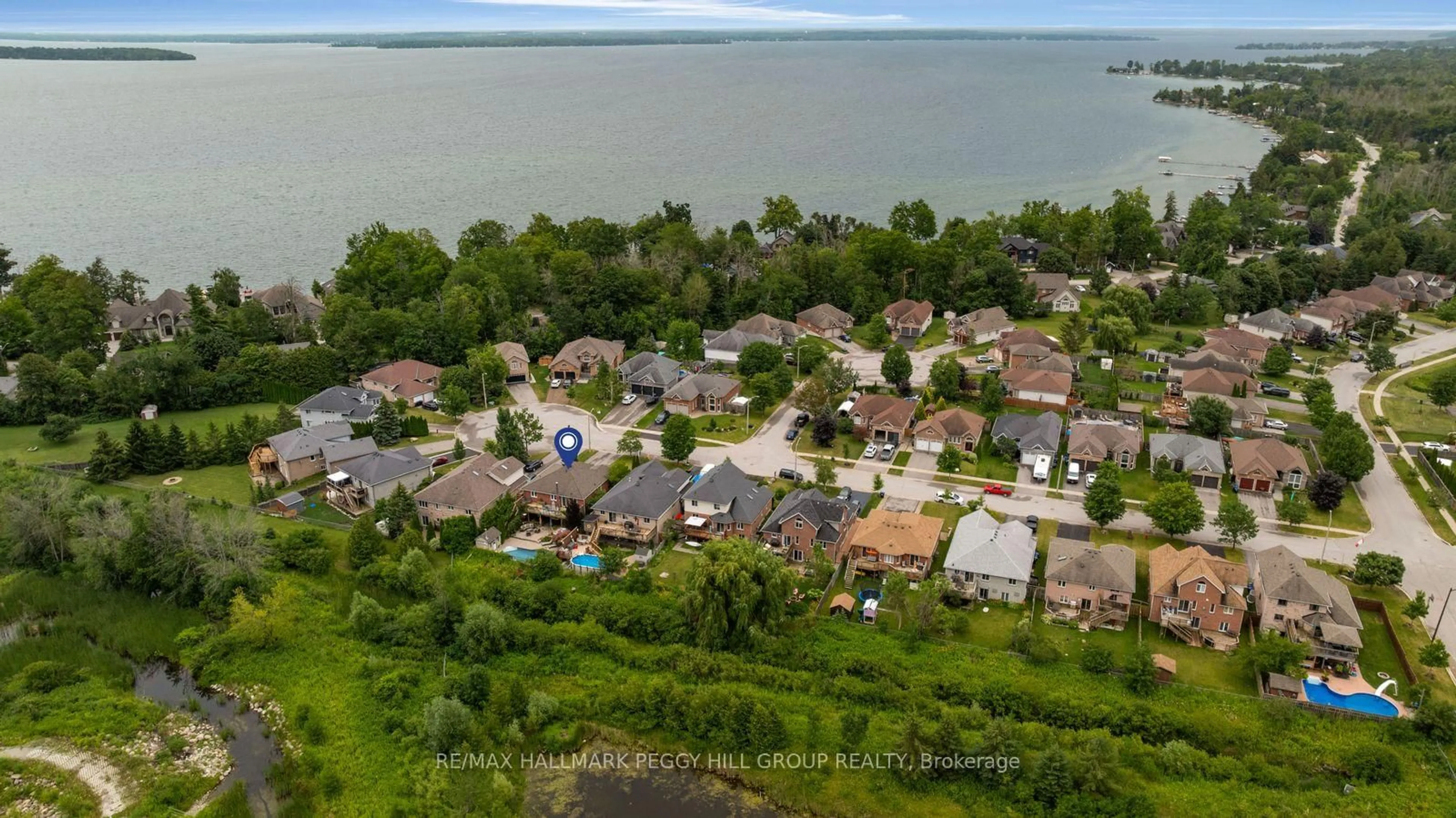 A pic from outside/outdoor area/front of a property/back of a property/a pic from drone, water/lake/river/ocean view for 608 Glen Cedar Cres, Innisfil Ontario L9S 2J4