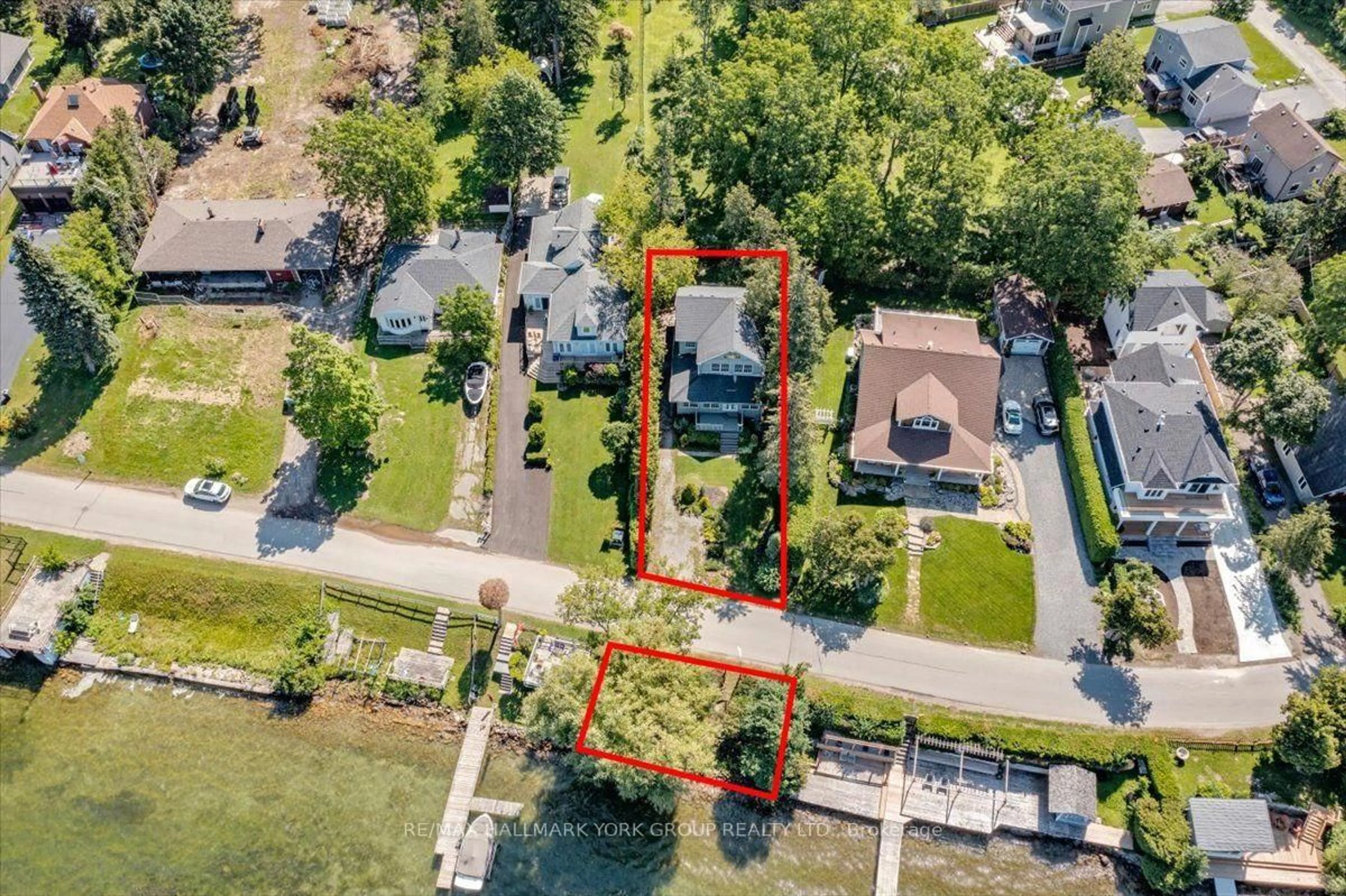 A pic from outside/outdoor area/front of a property/back of a property/a pic from drone, water/lake/river/ocean view for 311 Lake Dr, Georgina Ontario L4P 3C8