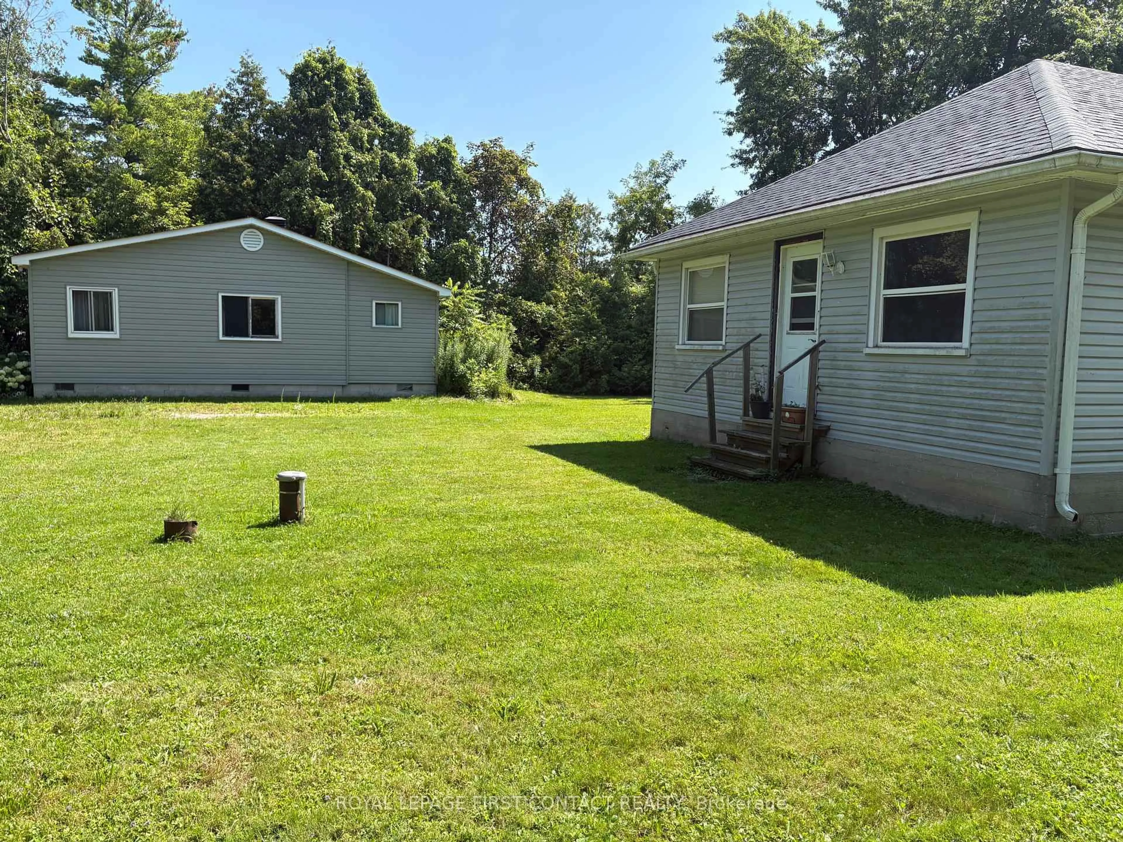 A pic from outside/outdoor area/front of a property/back of a property/a pic from drone, water/lake/river/ocean view for 691 6th Line, Innisfil Ontario L9S 4P9