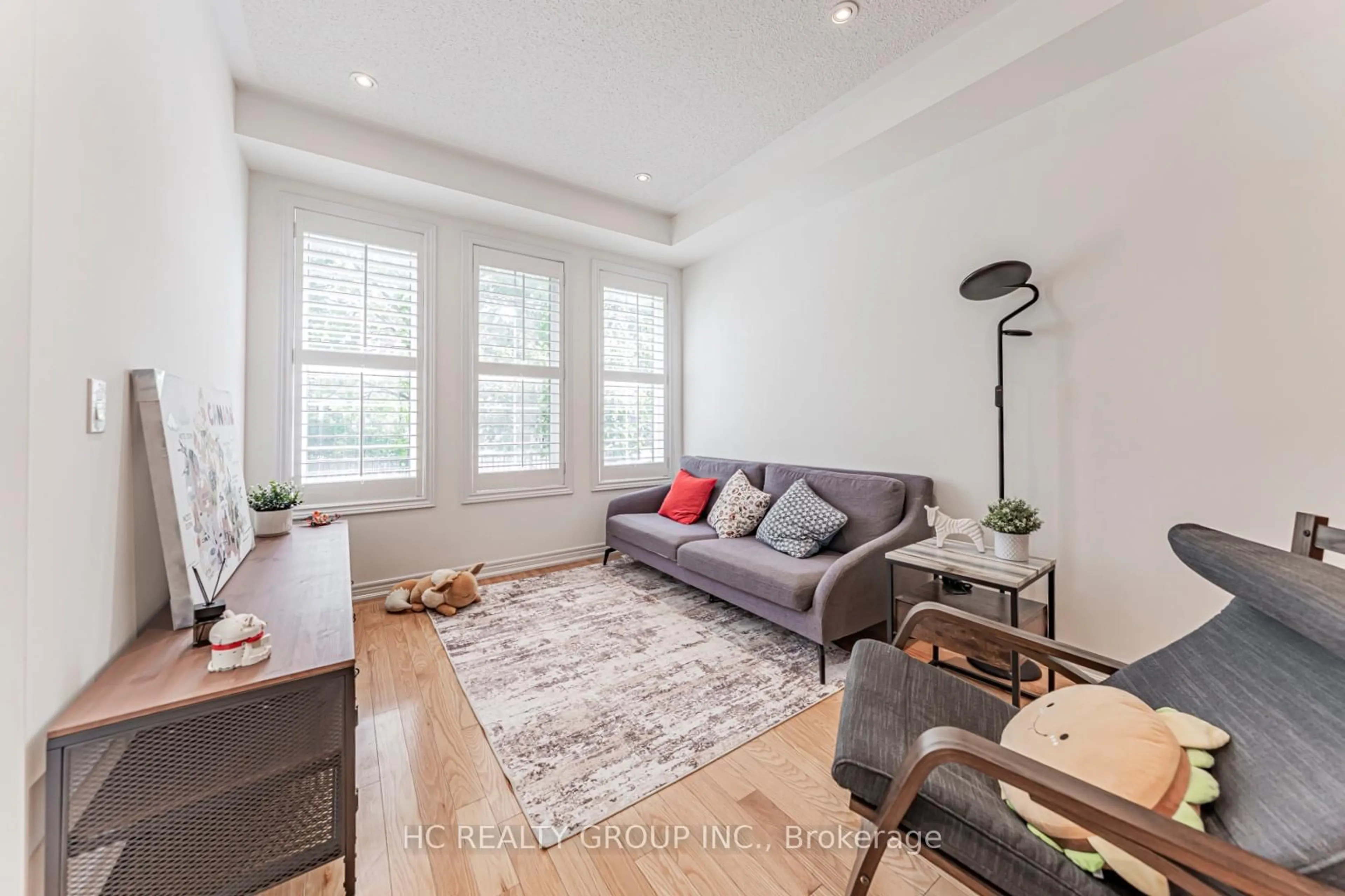 Living room with furniture, wood/laminate floor for 28 Poetry Dr, Vaughan Ontario L4H 3P7