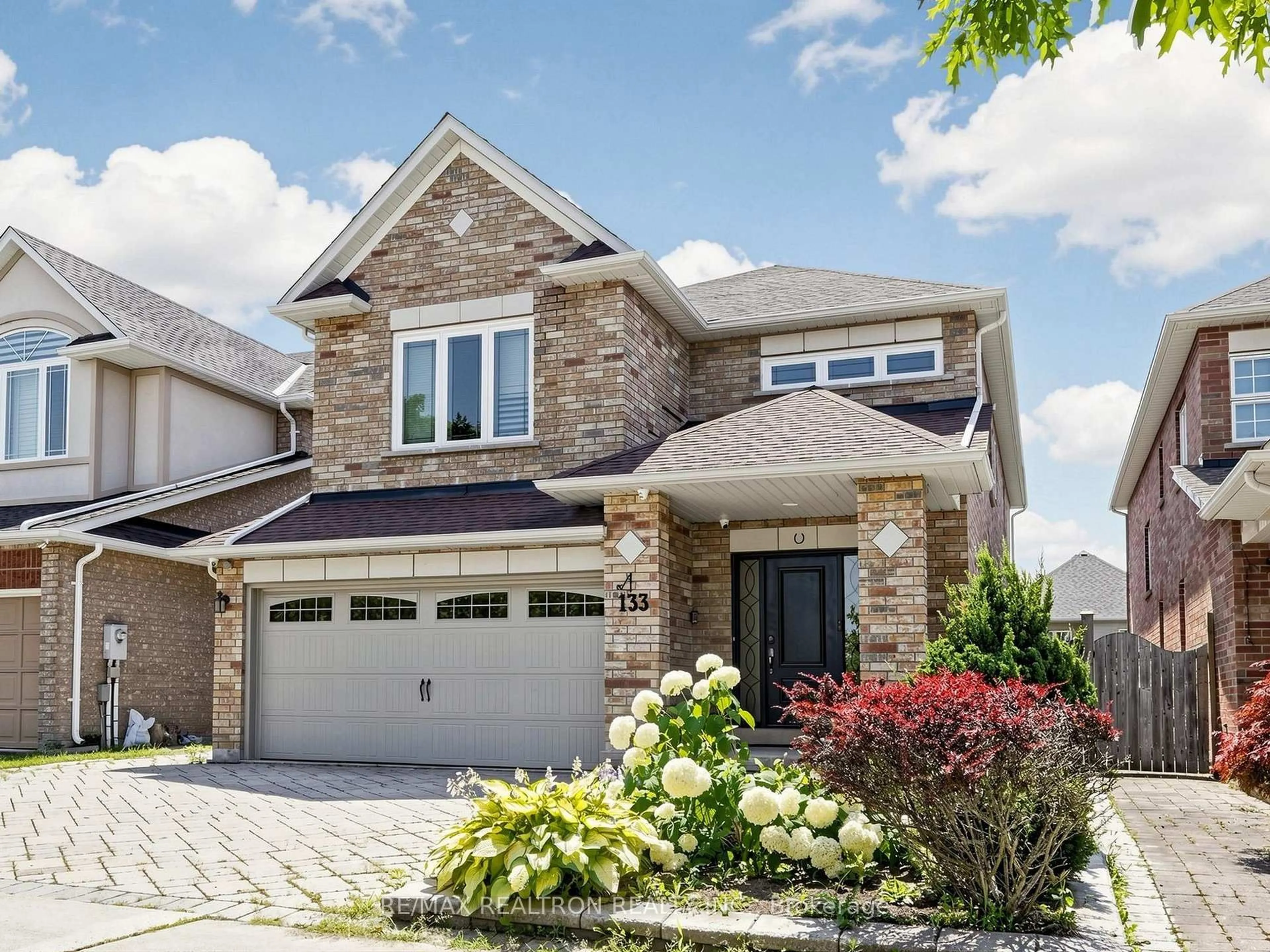 Home with brick exterior material, street for 133 Russell Jarvis Dr, Markham Ontario L3S 4L1