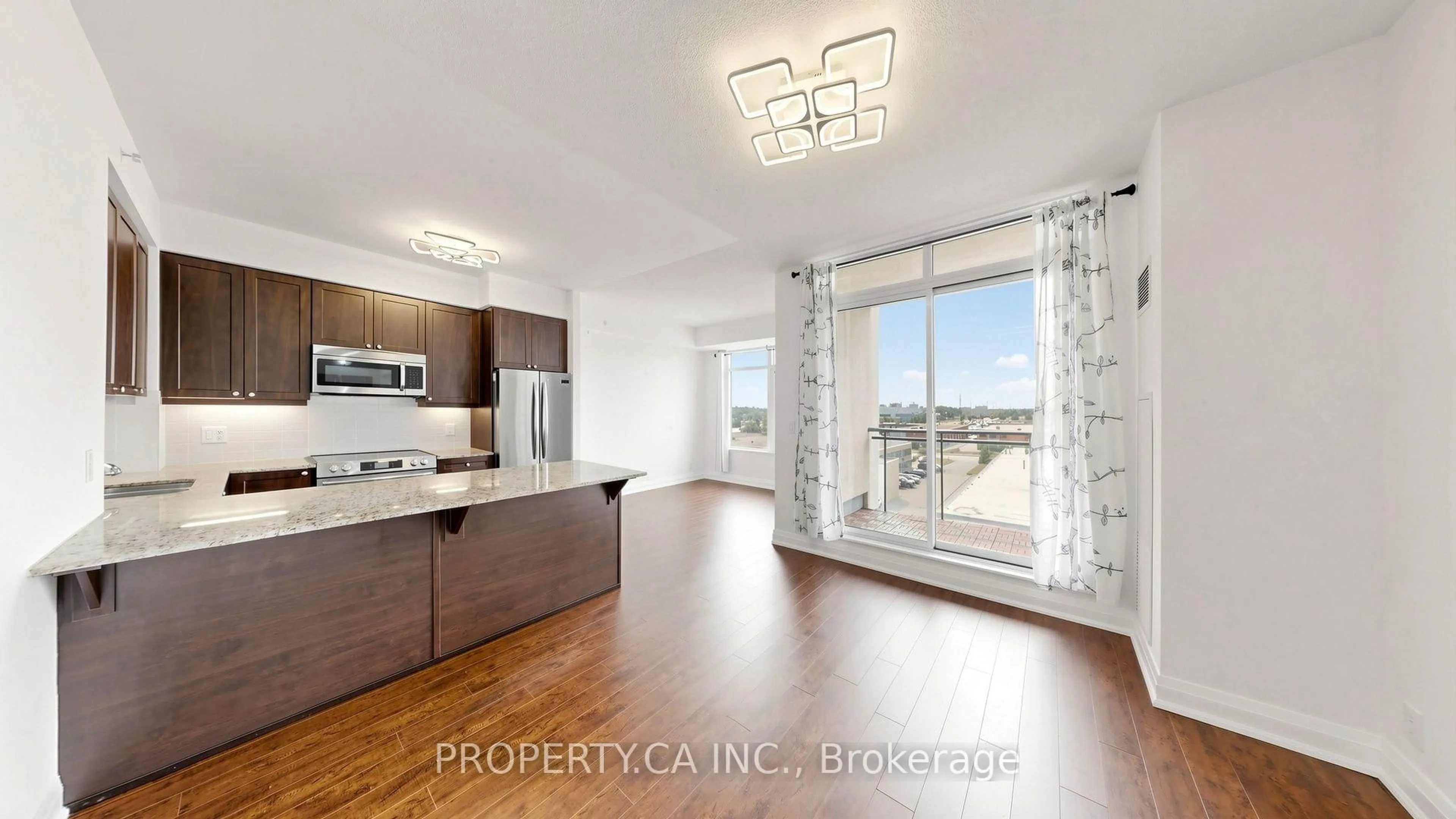 Open concept kitchen, wood/laminate floor for 24 Woodstream Blvd #516, Vaughan Ontario L4L 8C4