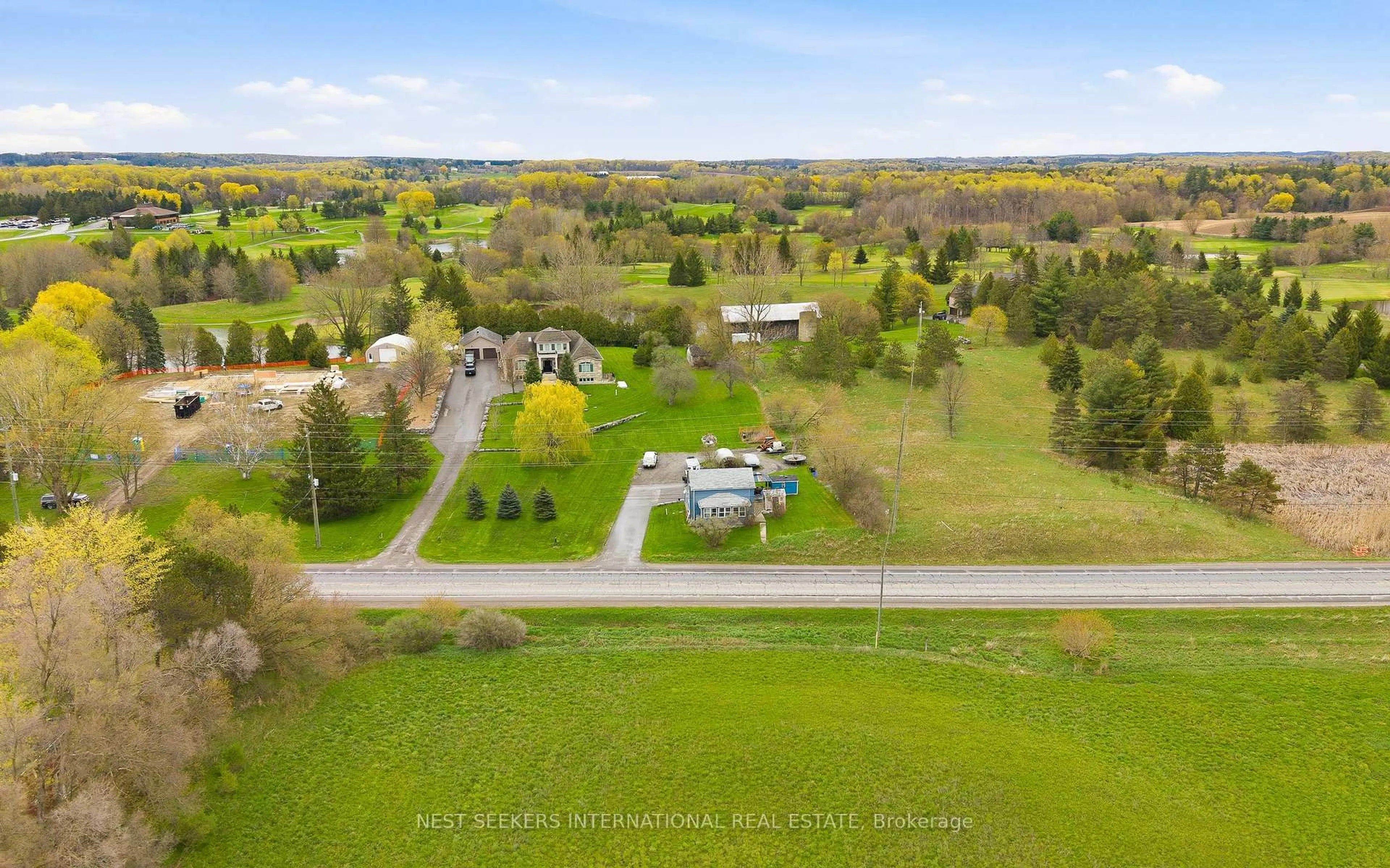 A pic from outside/outdoor area/front of a property/back of a property/a pic from drone, unknown for 14155 Highway 27, King Ontario L0G 1T0
