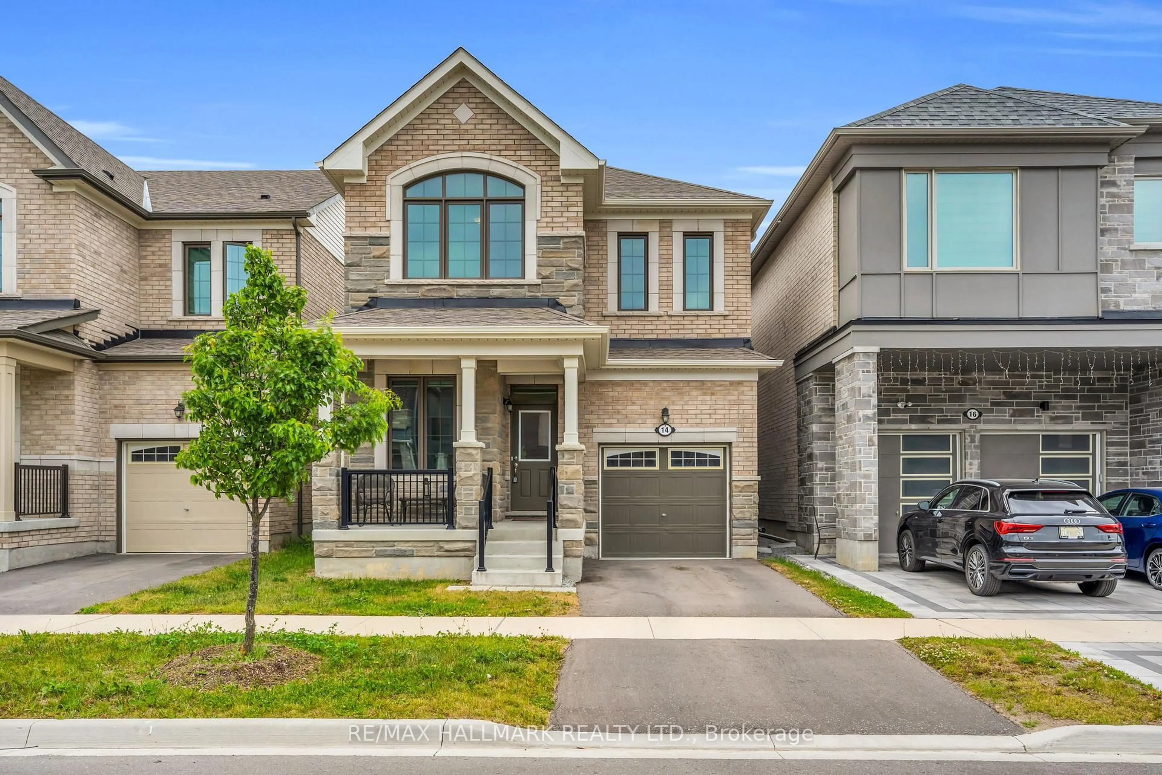 Home with brick exterior material, street for 14 Eberly Woods Dr, Markham Ontario L6C 3K5